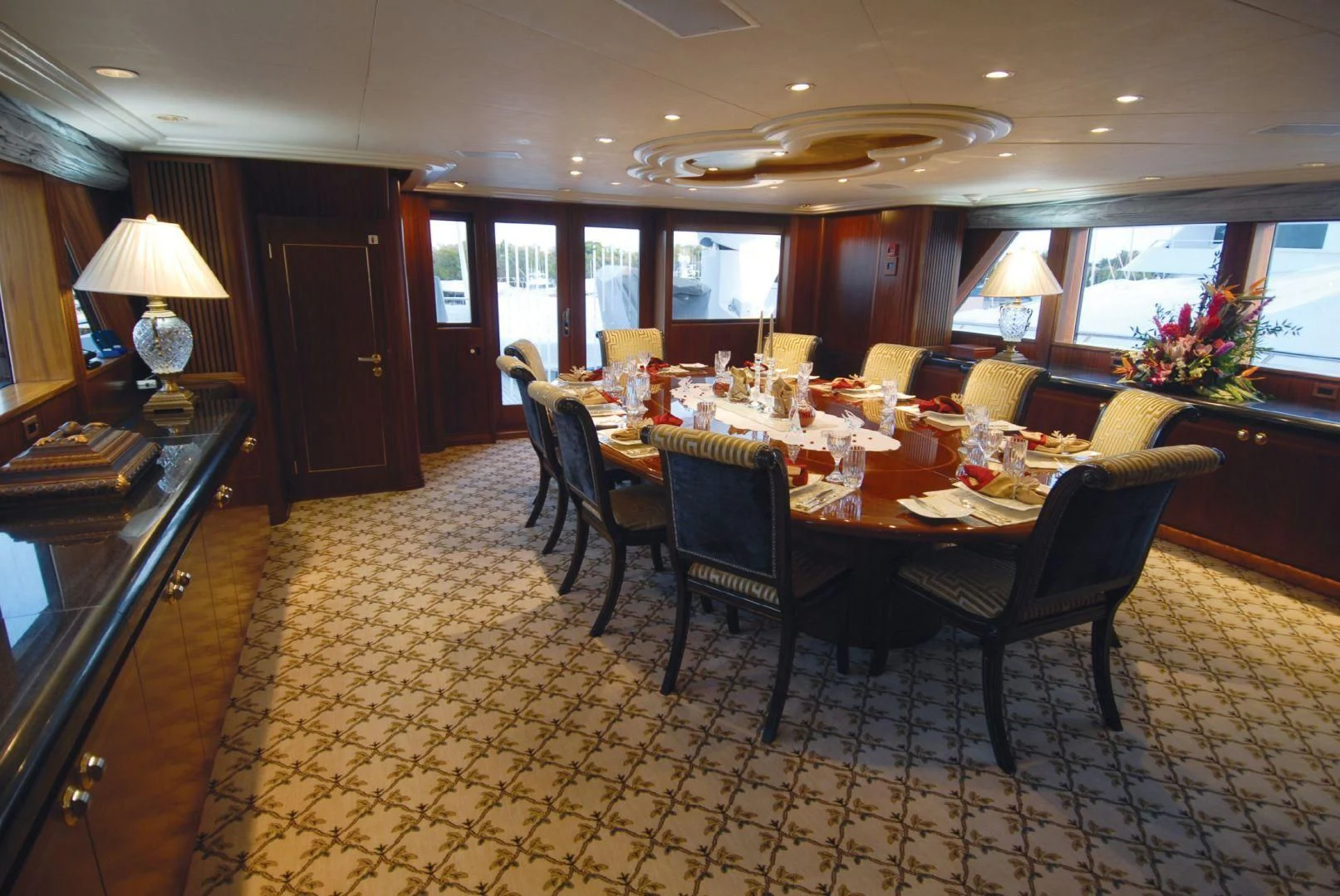 a dining room with a table and chairs aboard NEVER ENOUGH Yacht for Charter