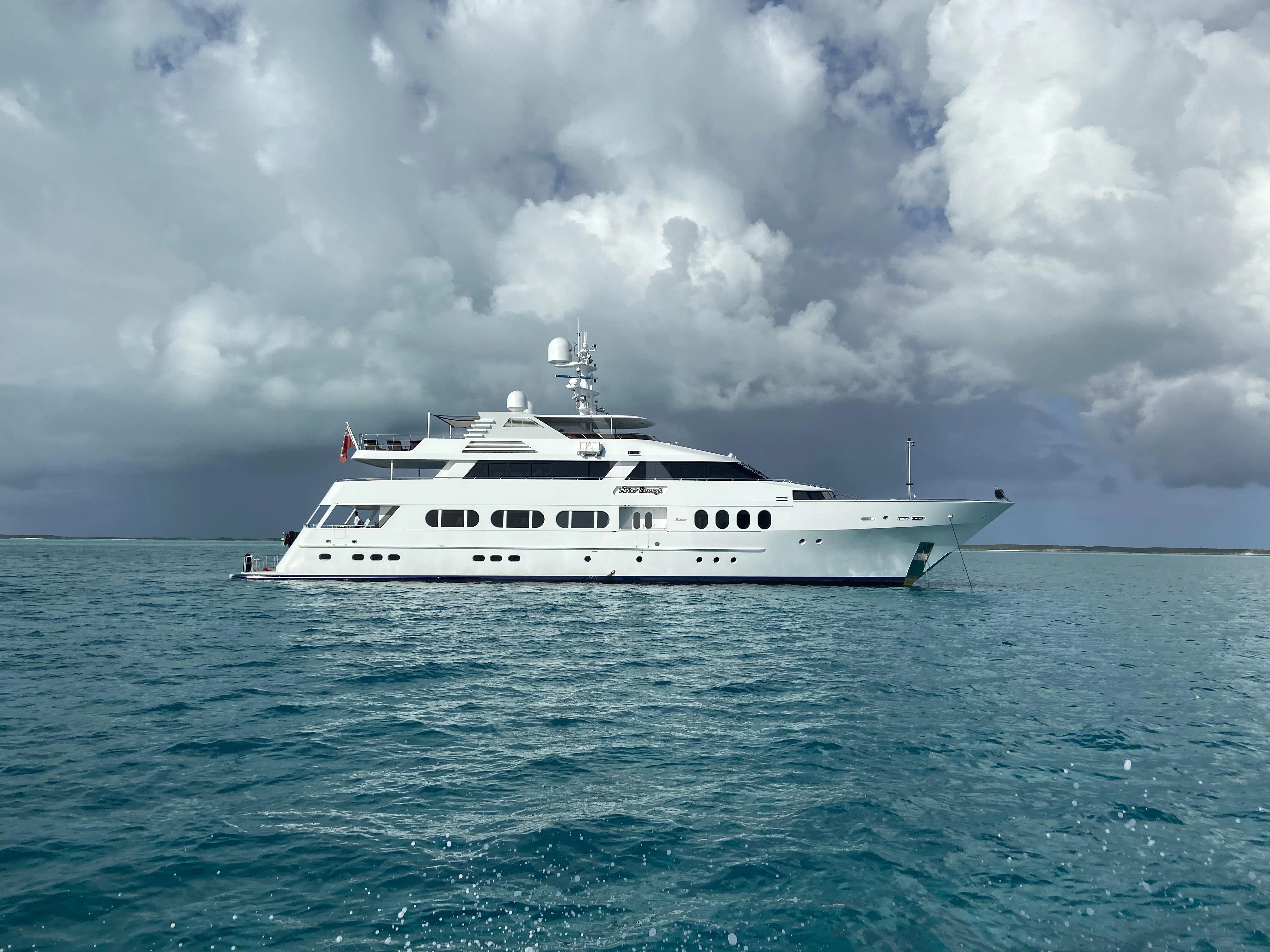 a white boat in the water aboard NEVER ENOUGH Yacht for Charter