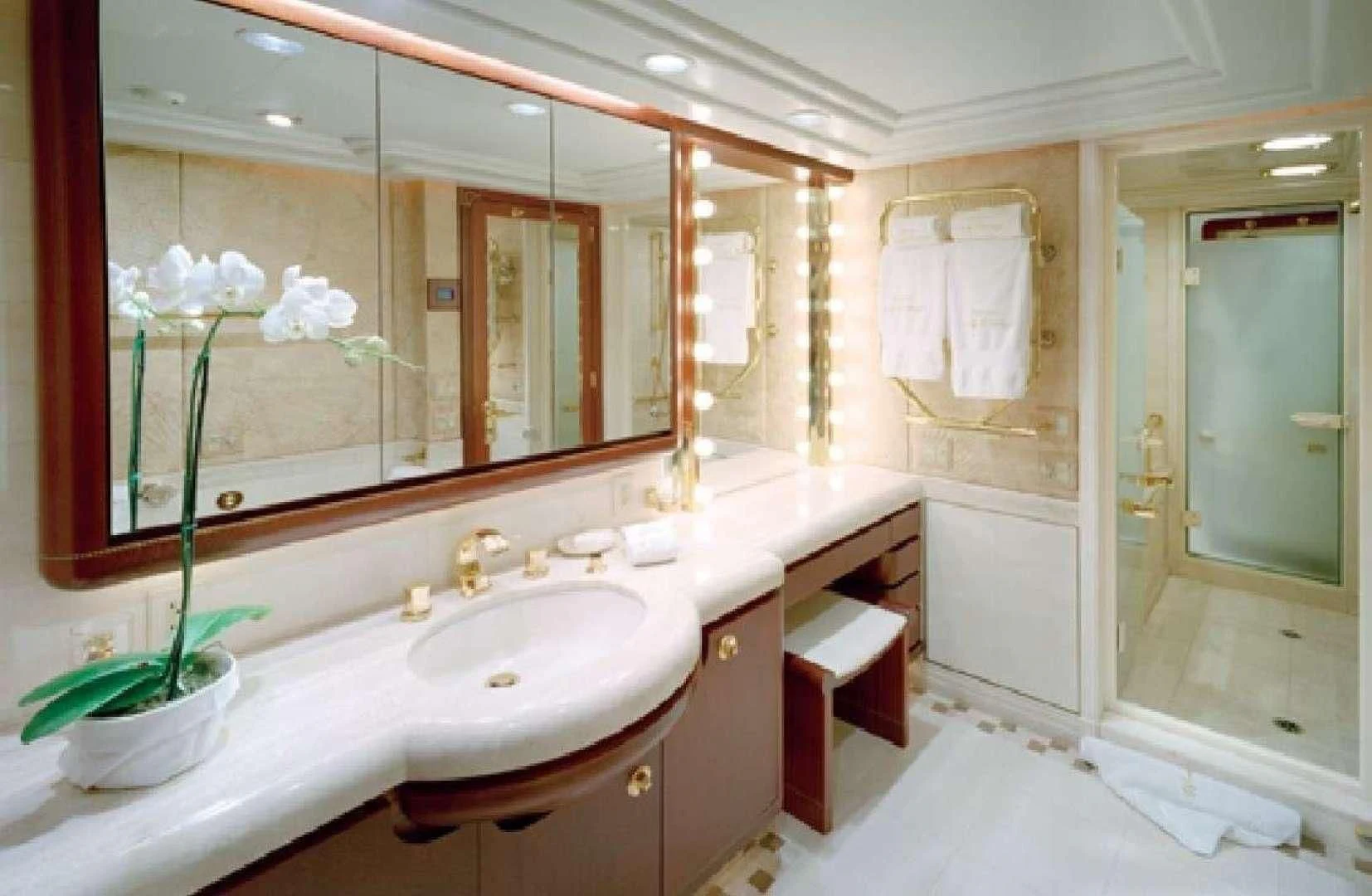 a bathroom with a large mirror aboard NEVER ENOUGH Yacht for Charter