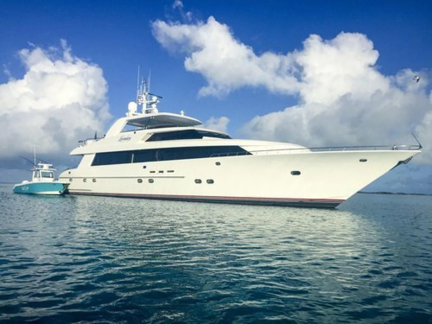 a white yacht in the water aboard NEVER ENOUGH Yacht for Charter
