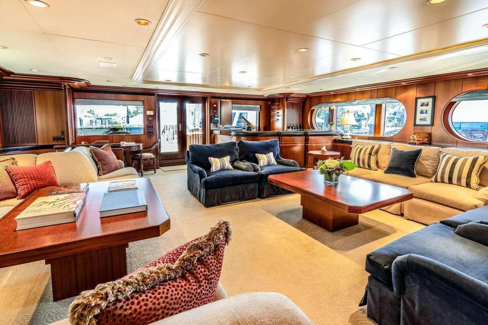 a living room with a couch and a coffee table aboard NEVER ENOUGH Yacht for Charter