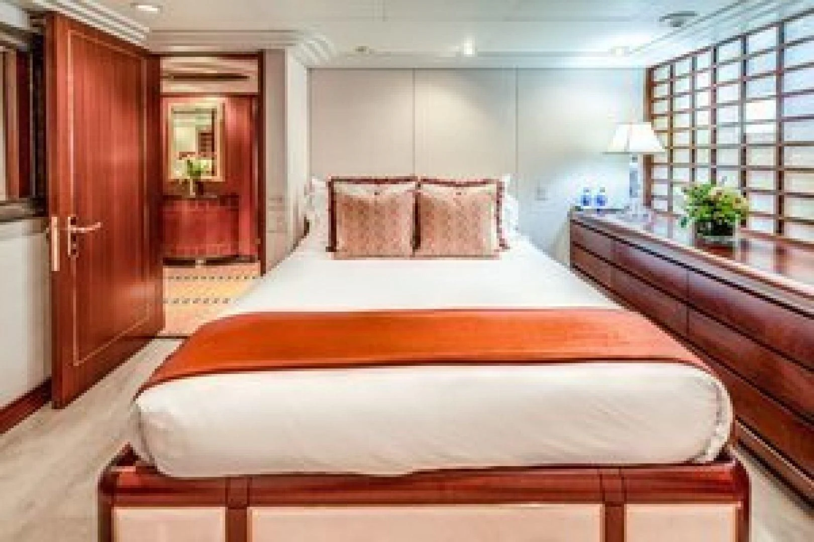 a large bed in a hotel room aboard NEVER ENOUGH Yacht for Charter