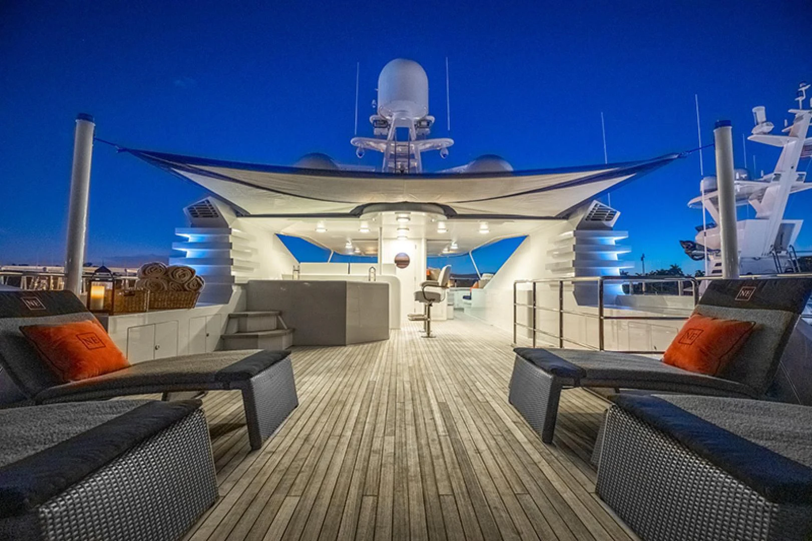 a deck with a deck and a large satellite dish on it aboard NEVER ENOUGH Yacht for Charter