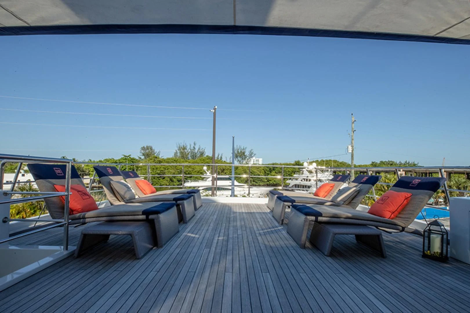 a deck with a pool and a deck with chairs and a pool aboard NEVER ENOUGH Yacht for Charter