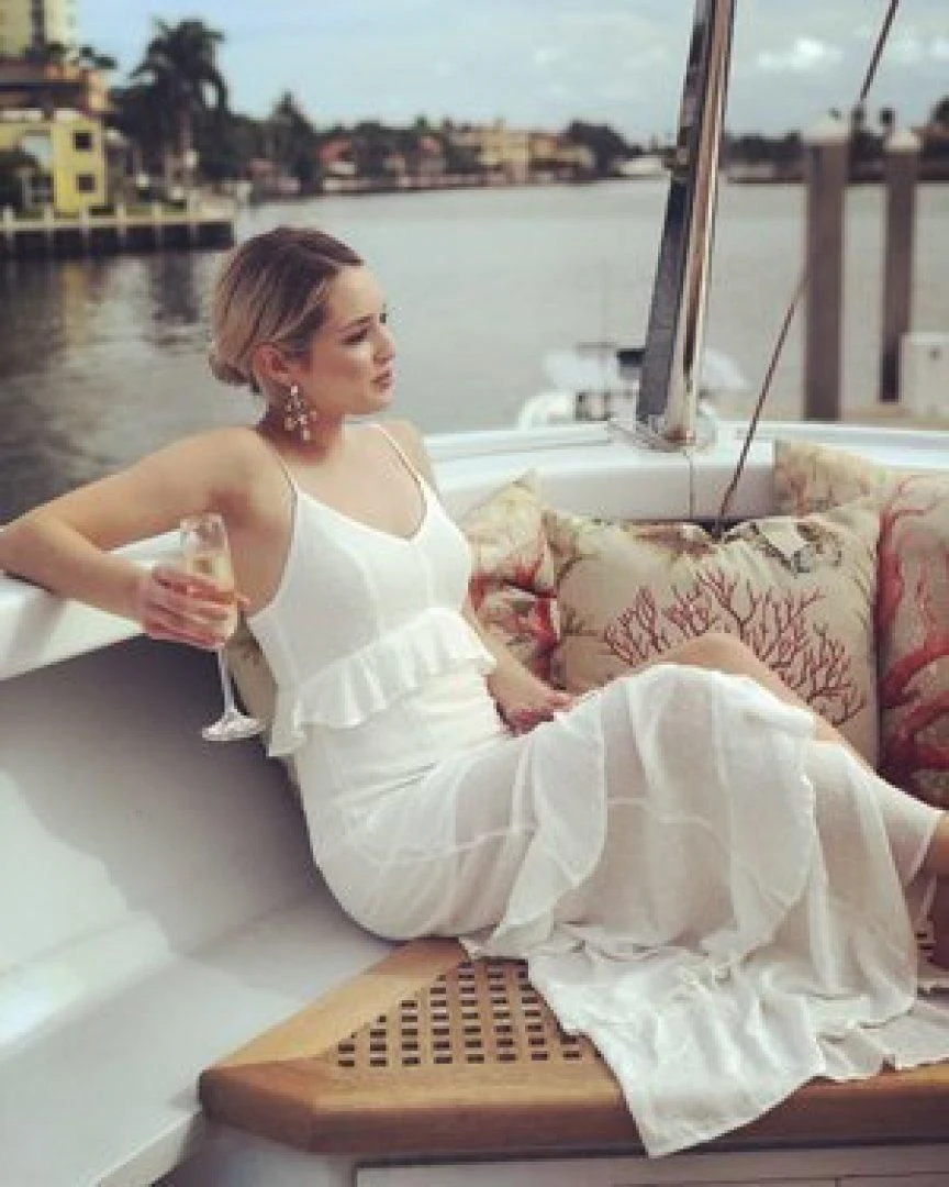 a woman sitting on a boat aboard NEVER ENOUGH Yacht for Charter