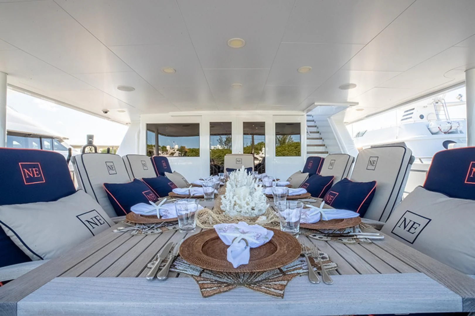 a large room with a table and chairs aboard NEVER ENOUGH Yacht for Charter