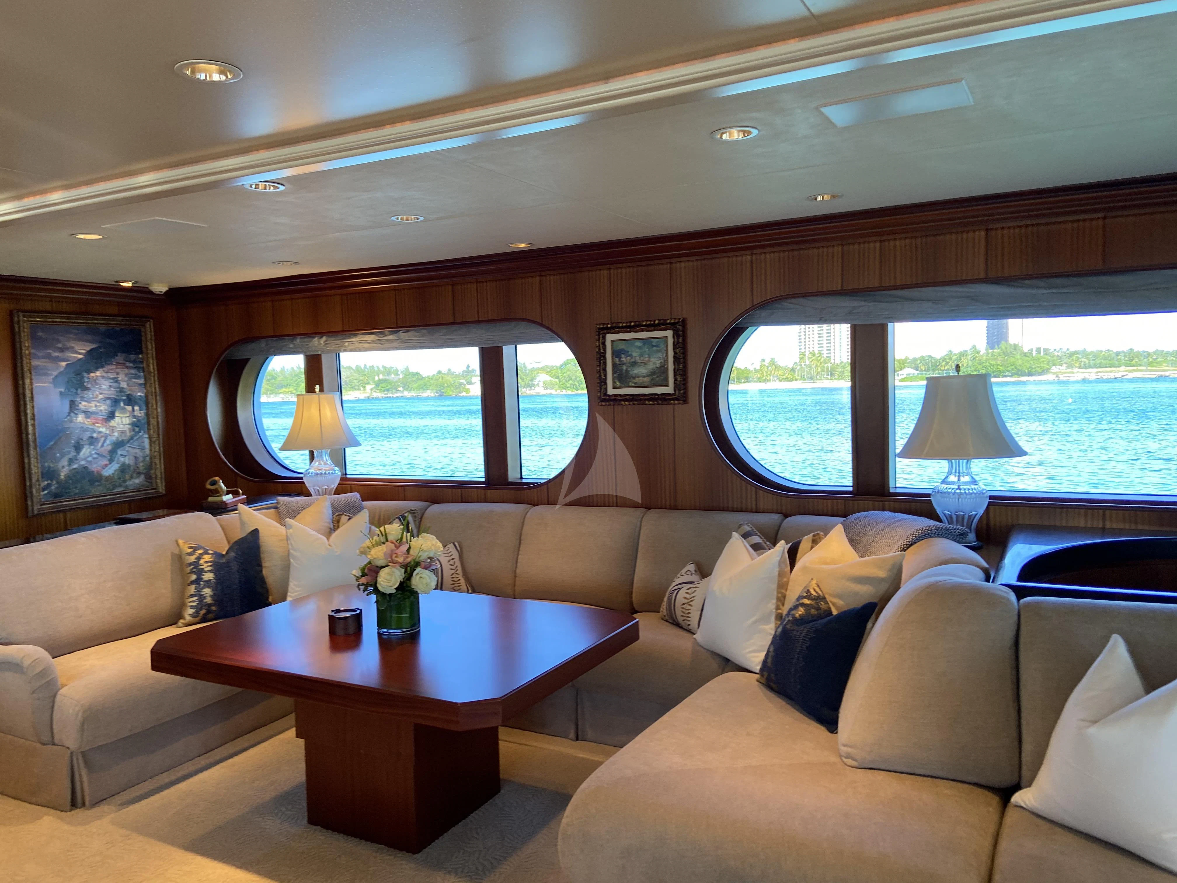 a living room with a large window aboard NEVER ENOUGH Yacht for Charter