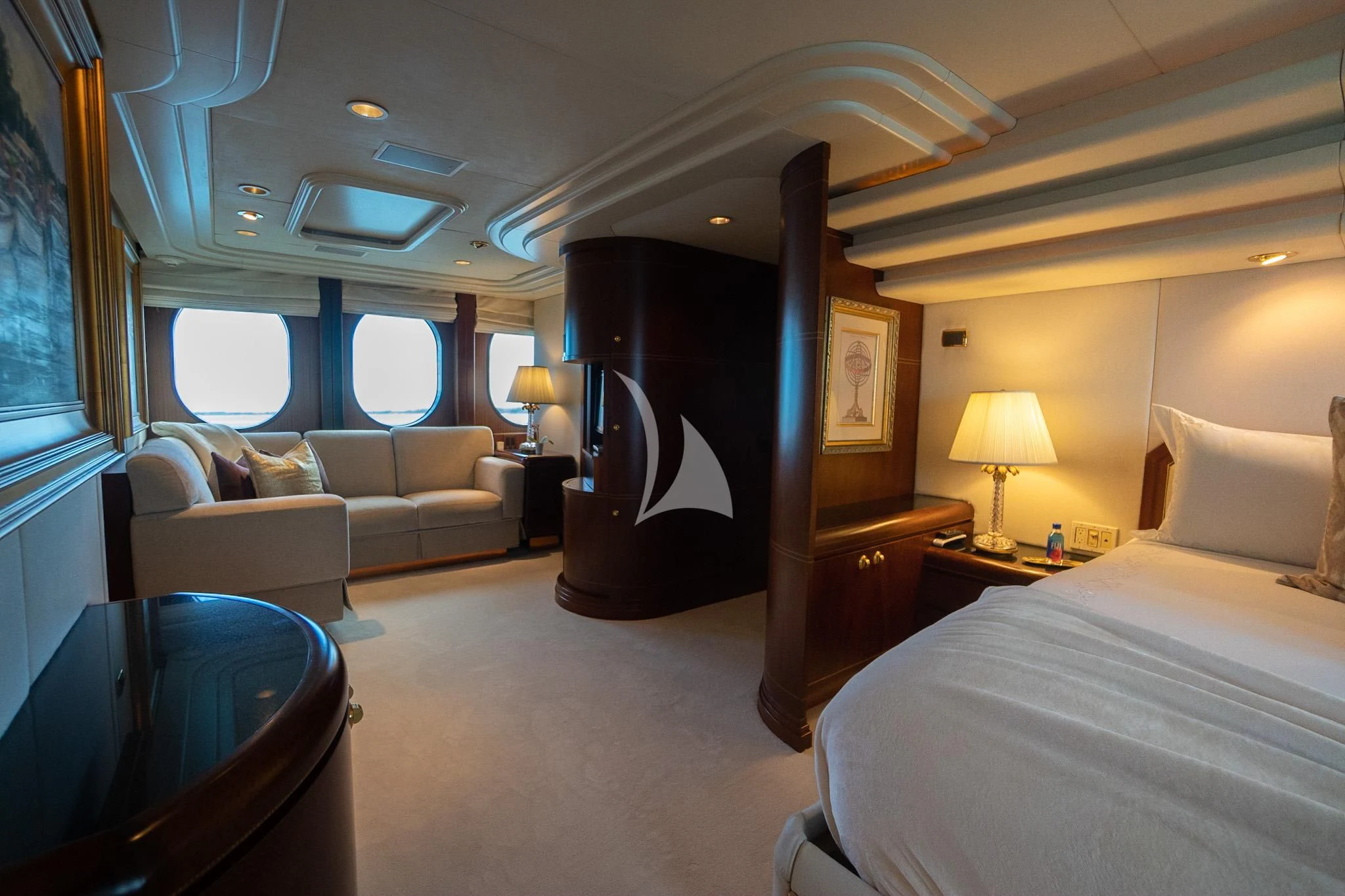 a bedroom with a bed and a couch aboard NEVER ENOUGH Yacht for Charter