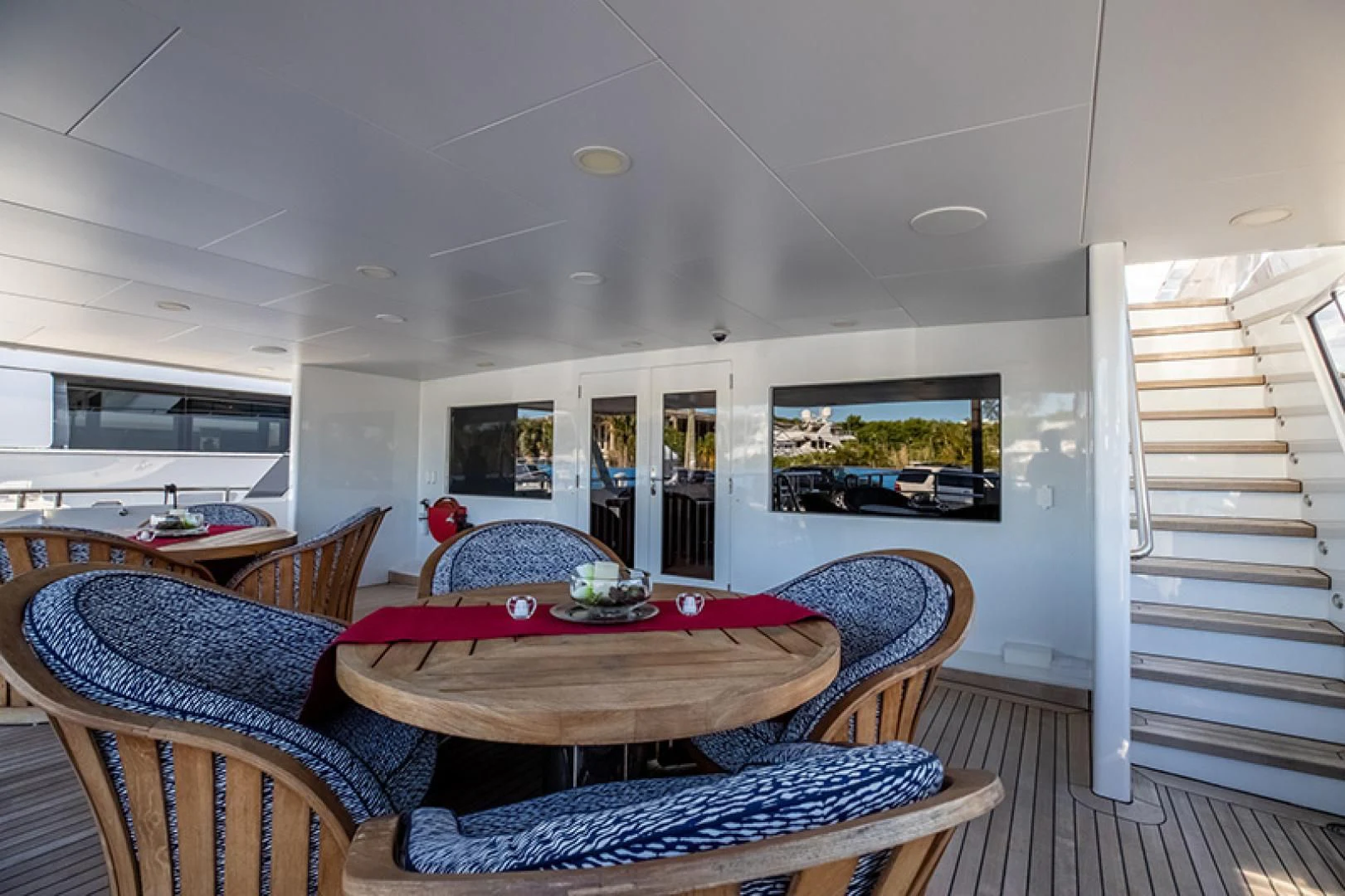 a living room with a couch and a television aboard NEVER ENOUGH Yacht for Charter