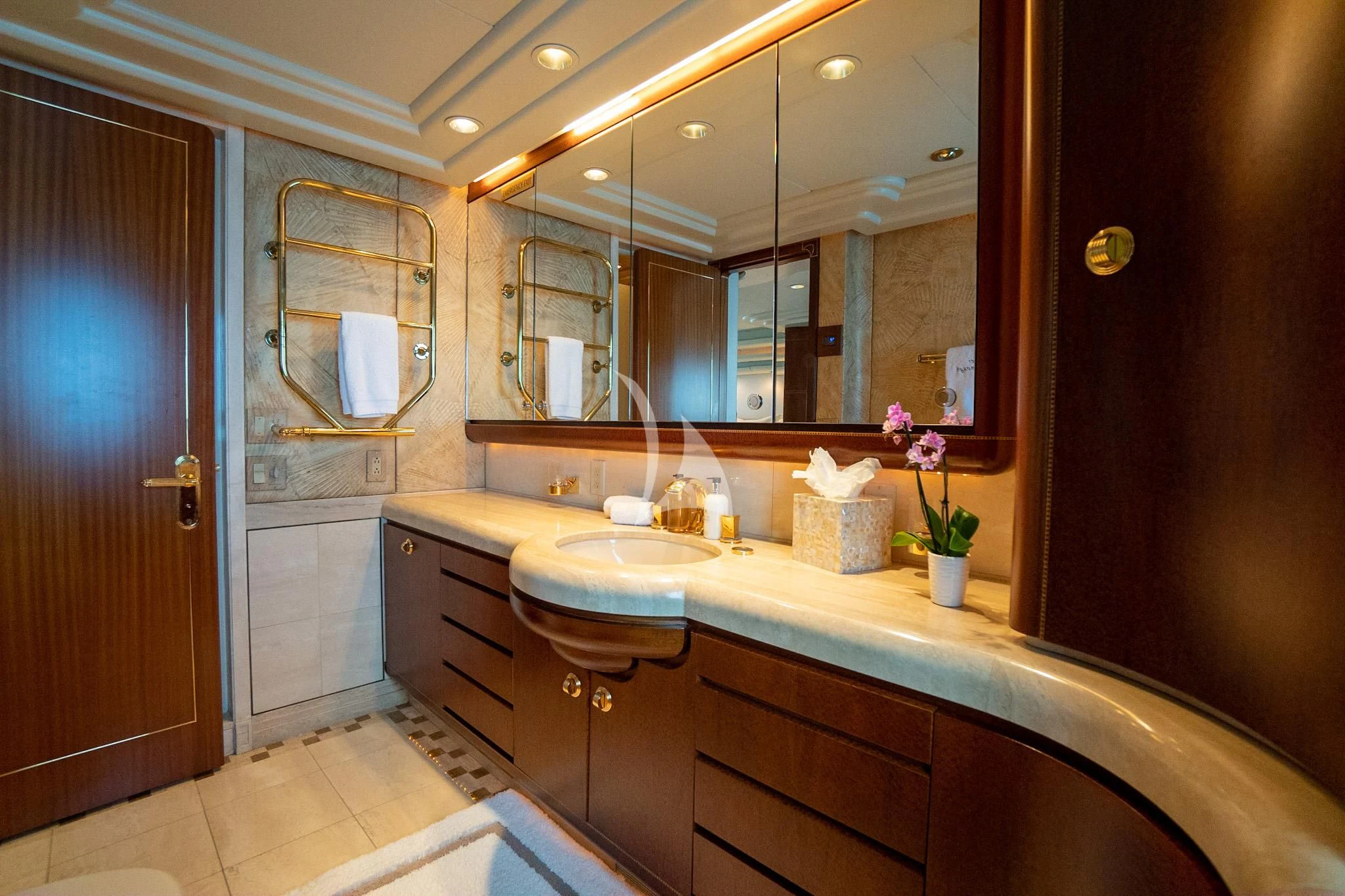 a bathroom with a large mirror aboard NEVER ENOUGH Yacht for Charter