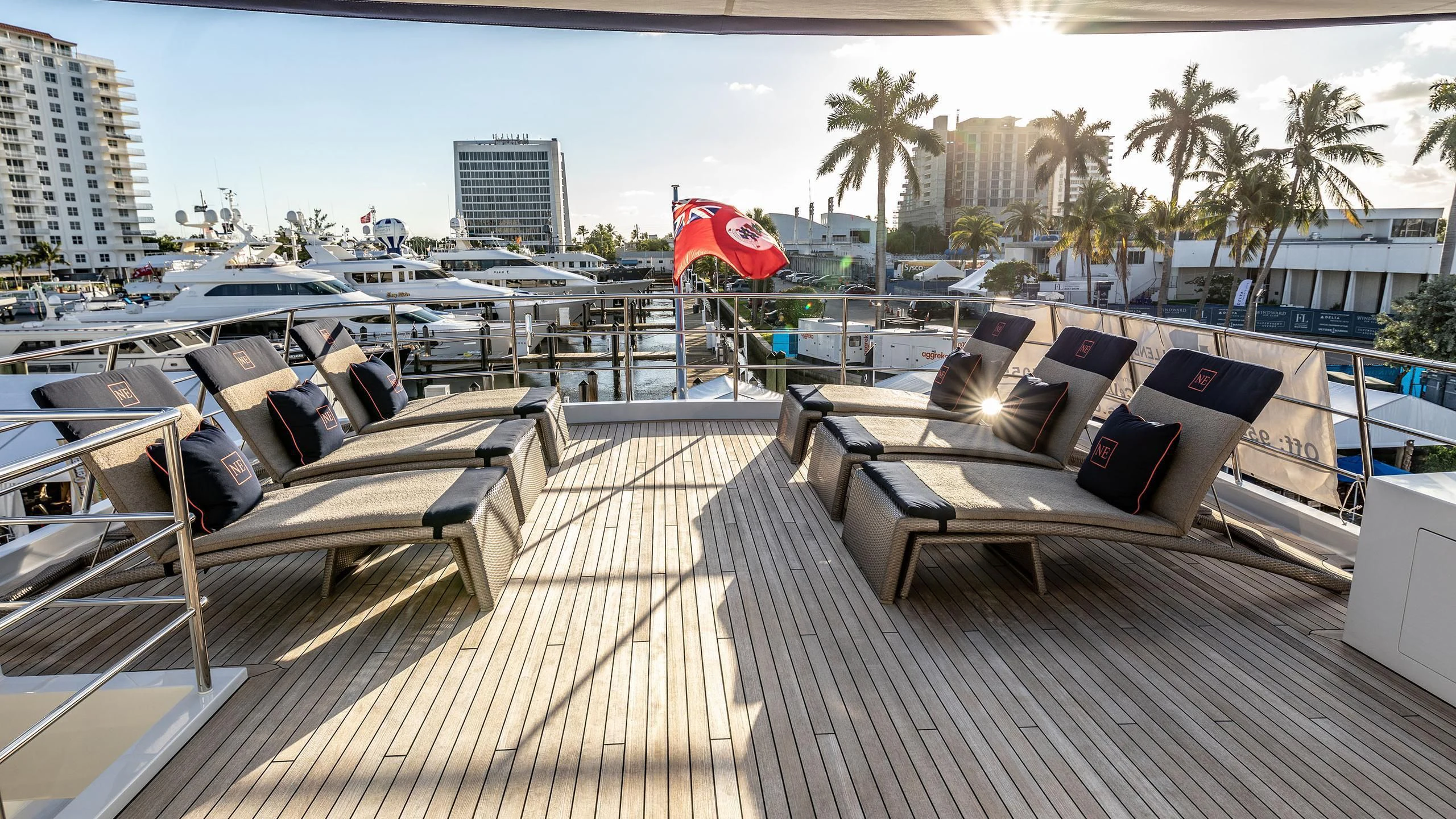 a deck with a couch and chairs on it aboard NEVER ENOUGH Yacht for Charter
