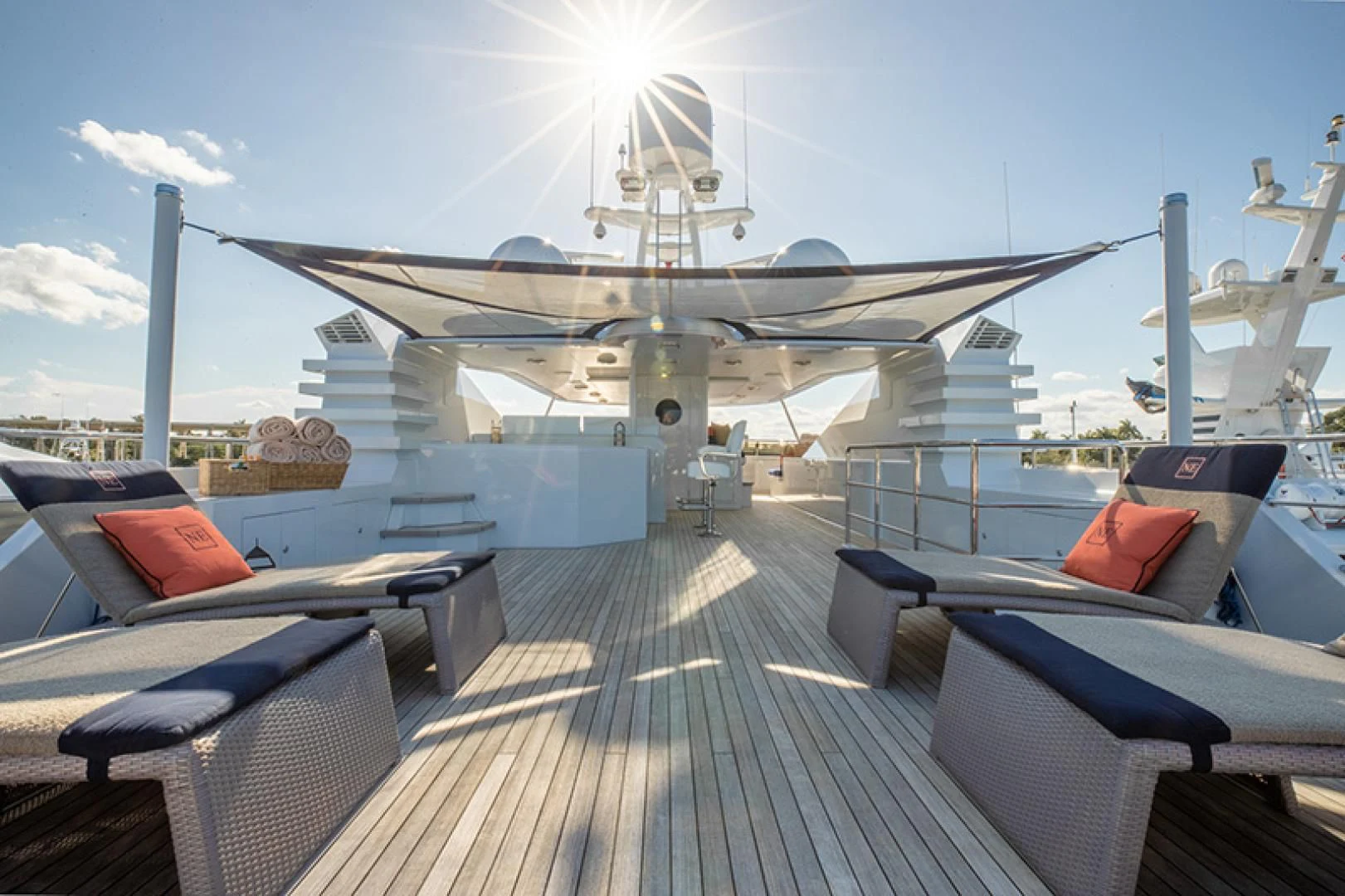 a deck with a deck and a large airplane on it aboard NEVER ENOUGH Yacht for Charter