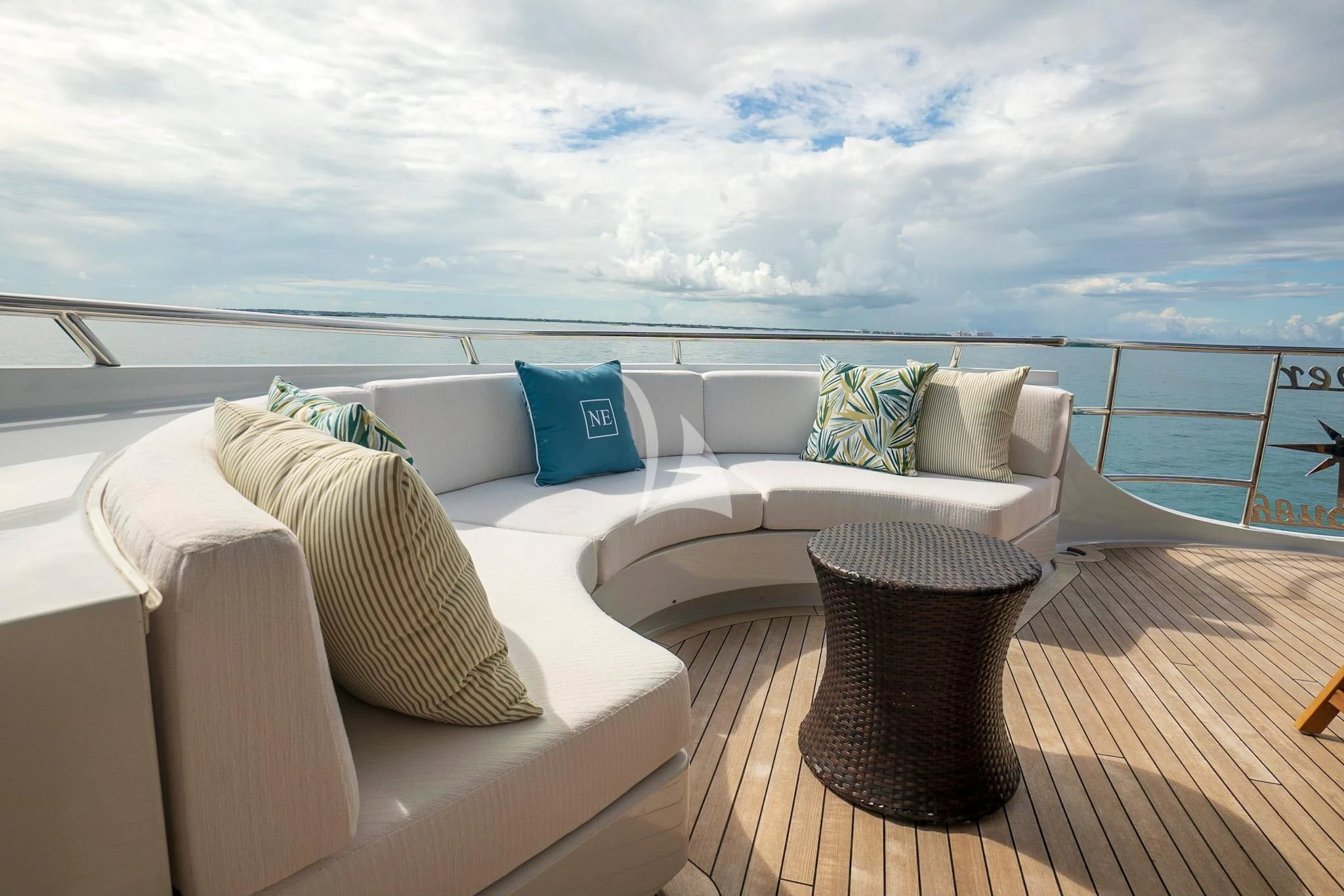 a balcony with a view of the ocean aboard NEVER ENOUGH Yacht for Charter