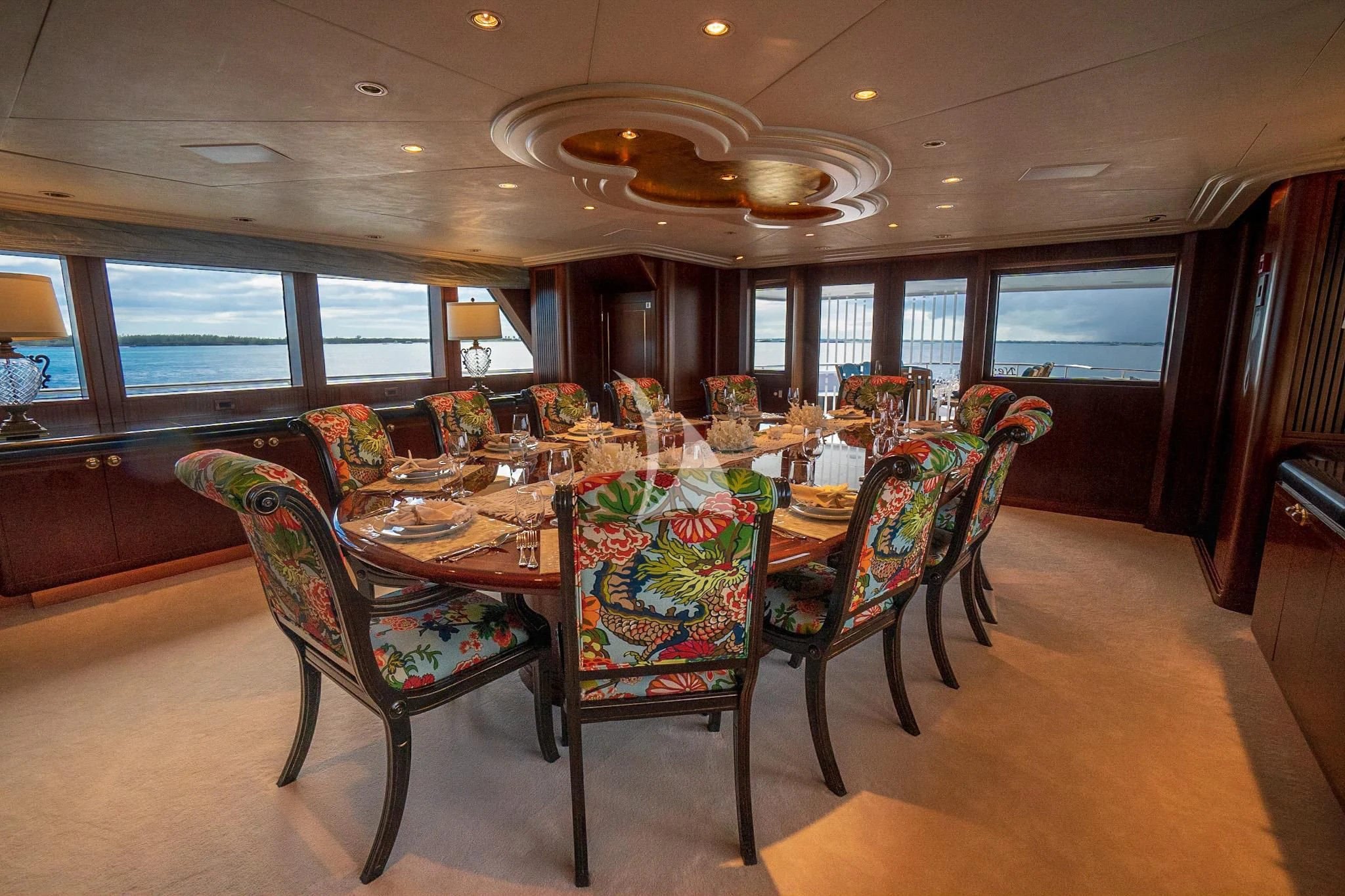 a dining room with a table and chairs aboard NEVER ENOUGH Yacht for Charter