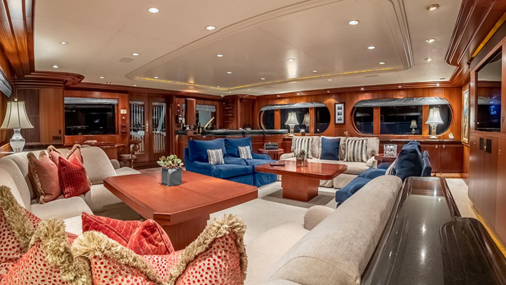 a living room with a couch and a table aboard NEVER ENOUGH Yacht for Charter