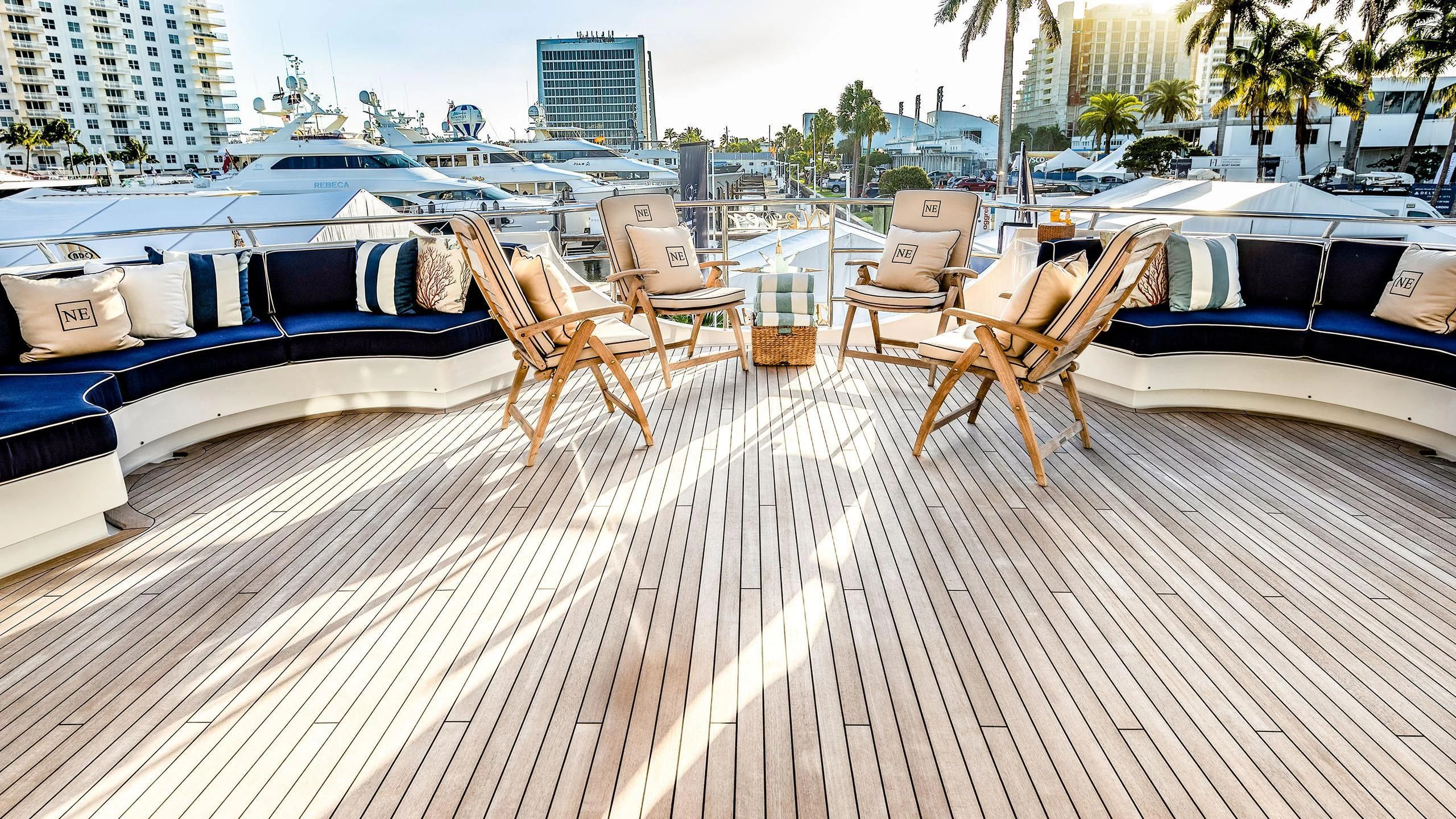 a deck with chairs and tables on it aboard NEVER ENOUGH Yacht for Charter
