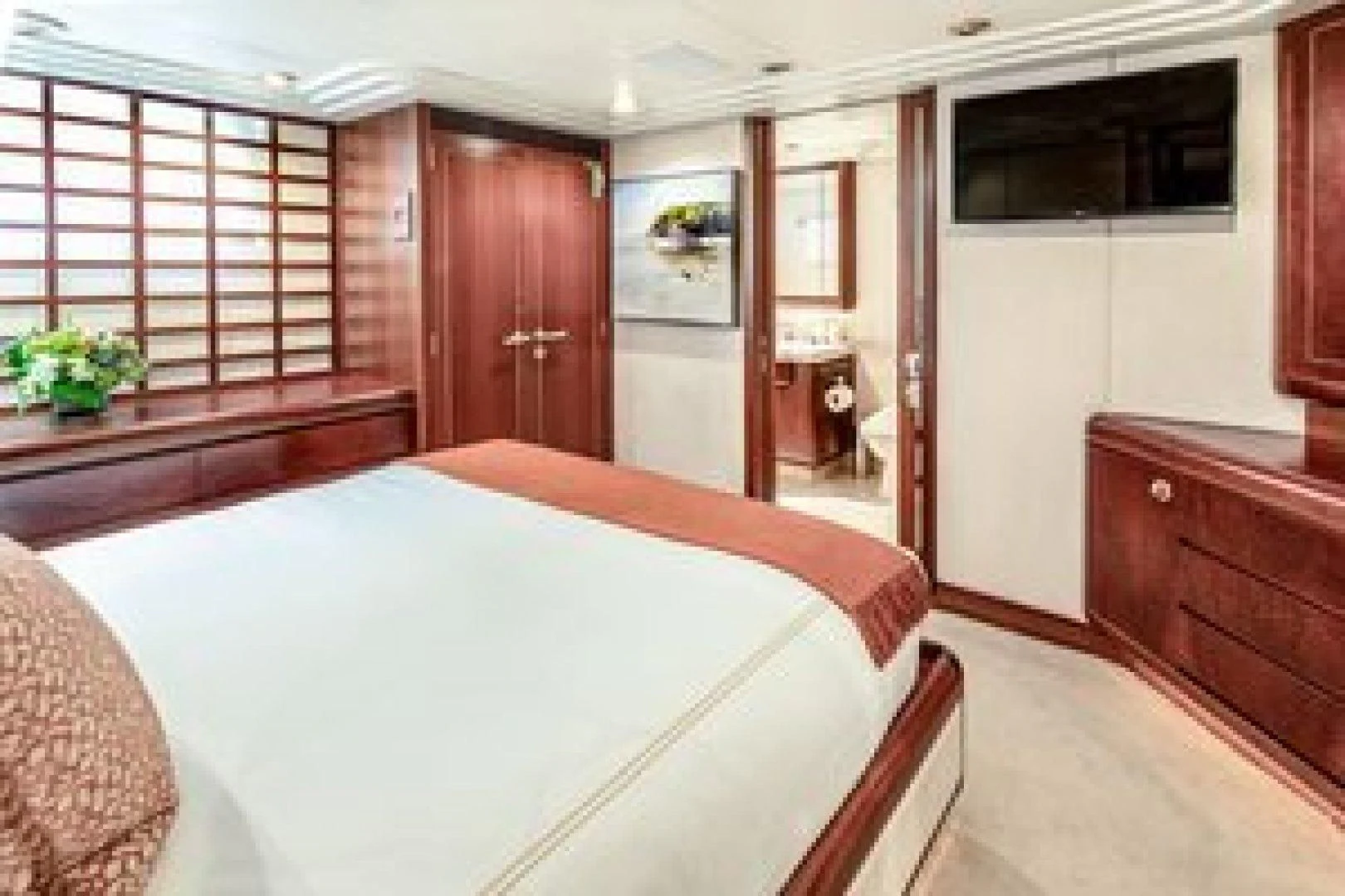 a bedroom with a large bed aboard NEVER ENOUGH Yacht for Charter