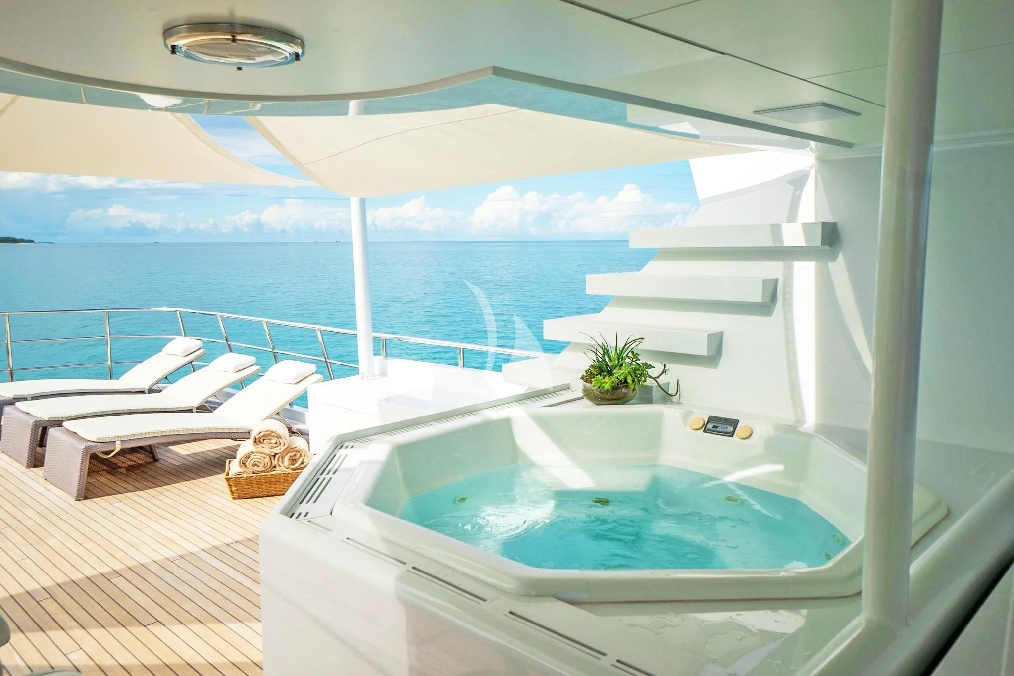 a room with a pool and a view of the ocean aboard NEVER ENOUGH Yacht for Charter