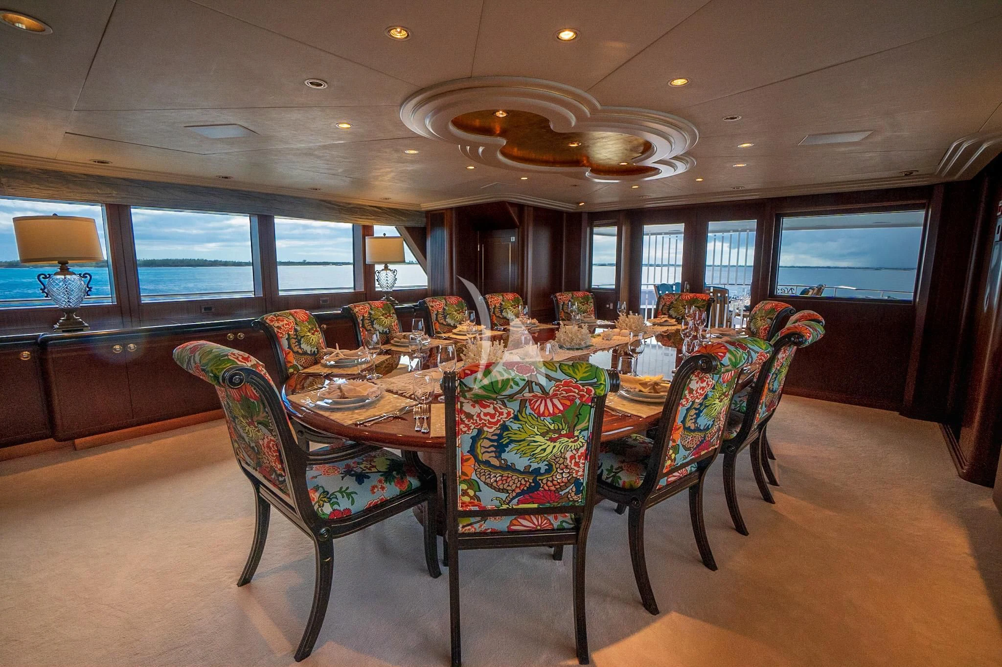 a dining room with a table and chairs aboard NEVER ENOUGH Yacht for Charter