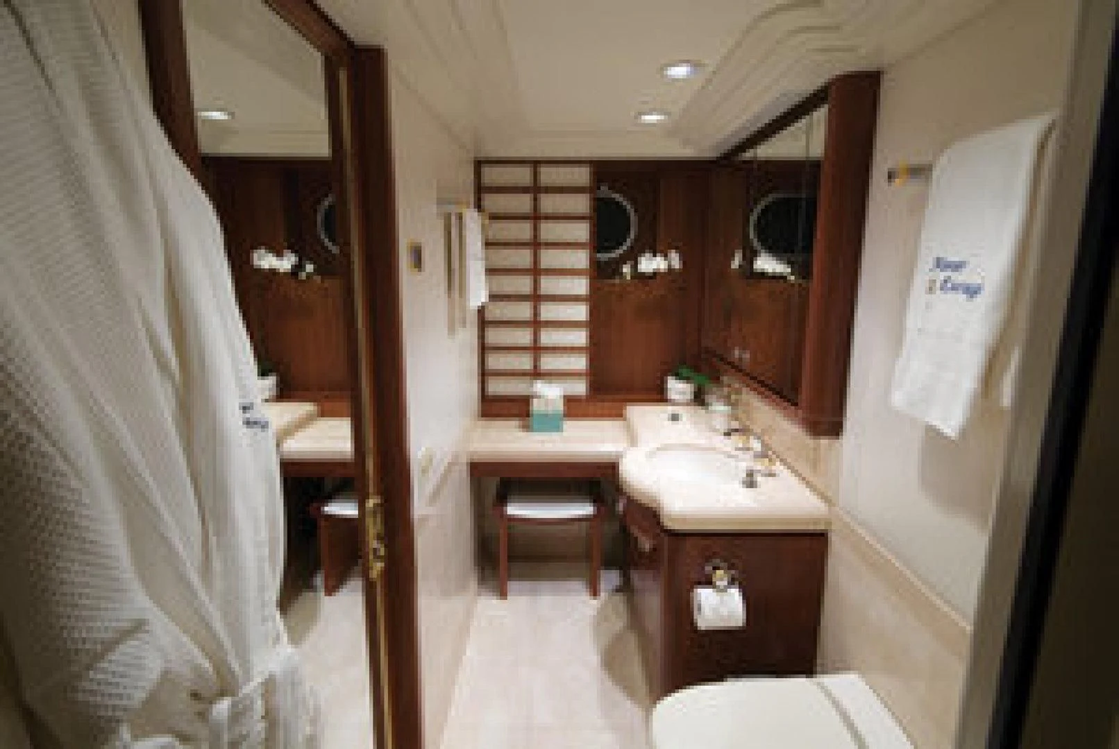 a bathroom with a sink and a mirror aboard NEVER ENOUGH Yacht for Charter