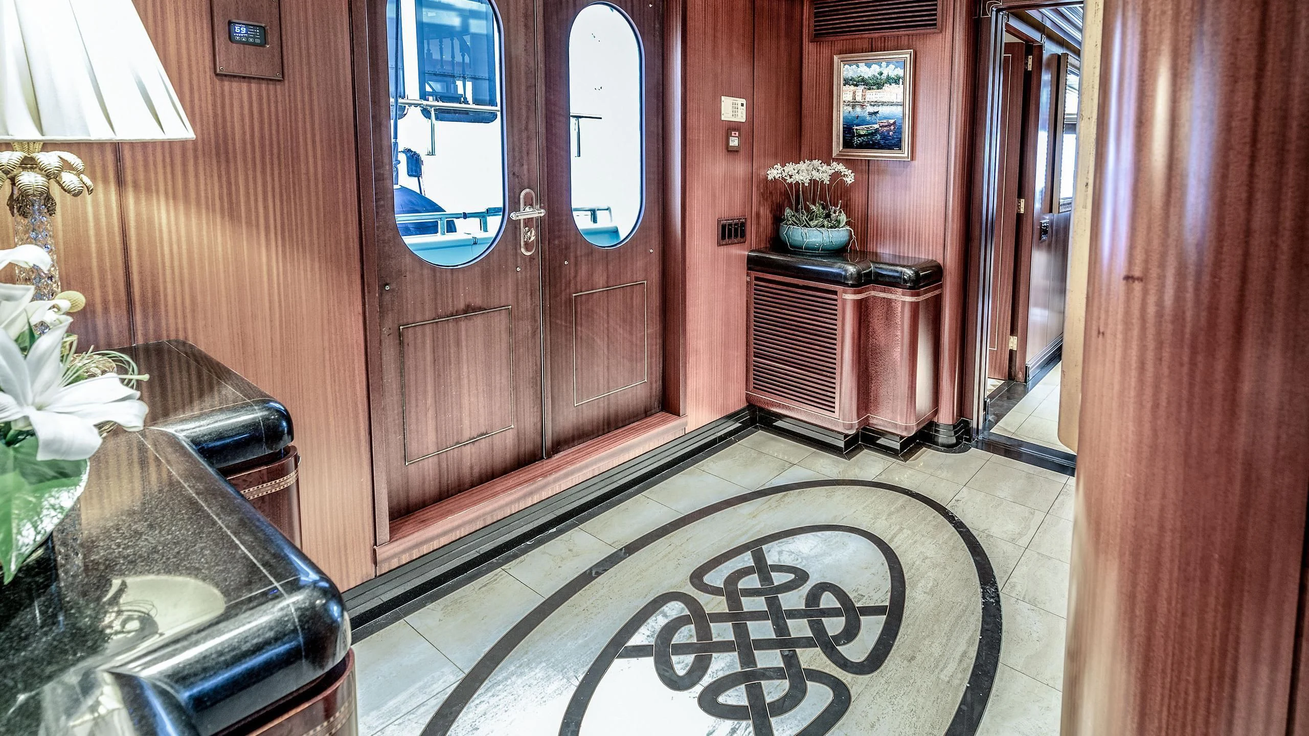 a room with a sink and a door aboard NEVER ENOUGH Yacht for Charter