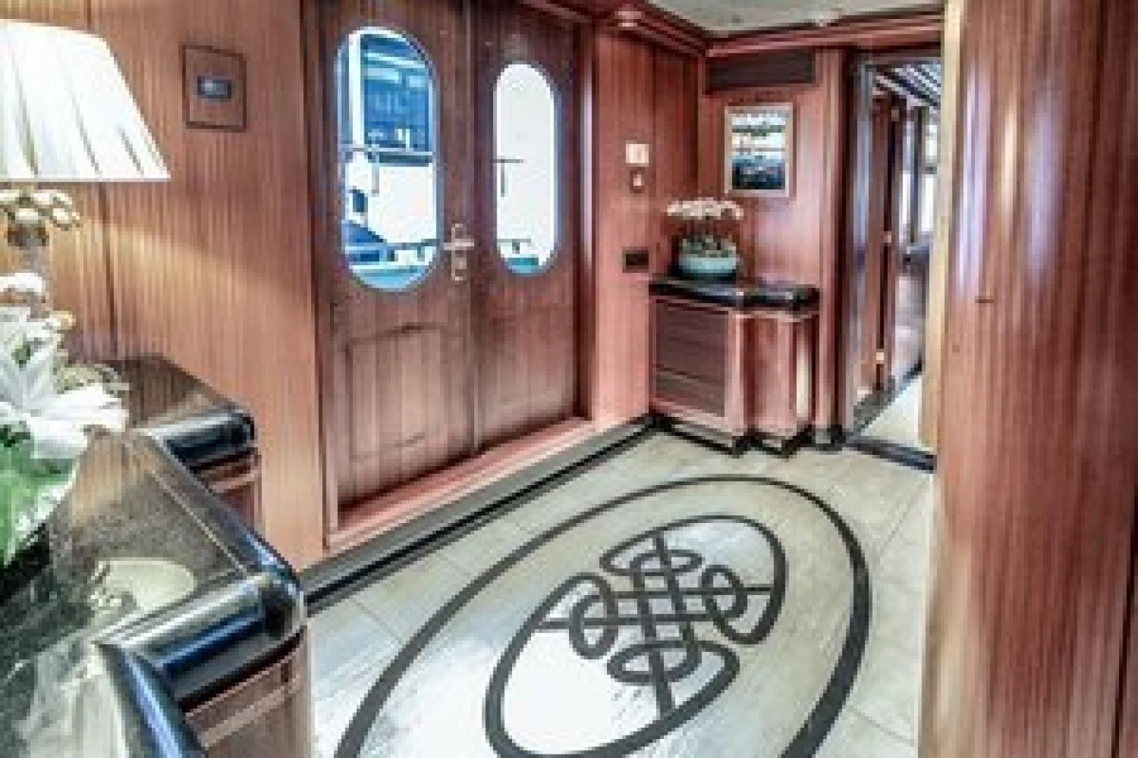 a hallway with a carpet and a door aboard NEVER ENOUGH Yacht for Charter