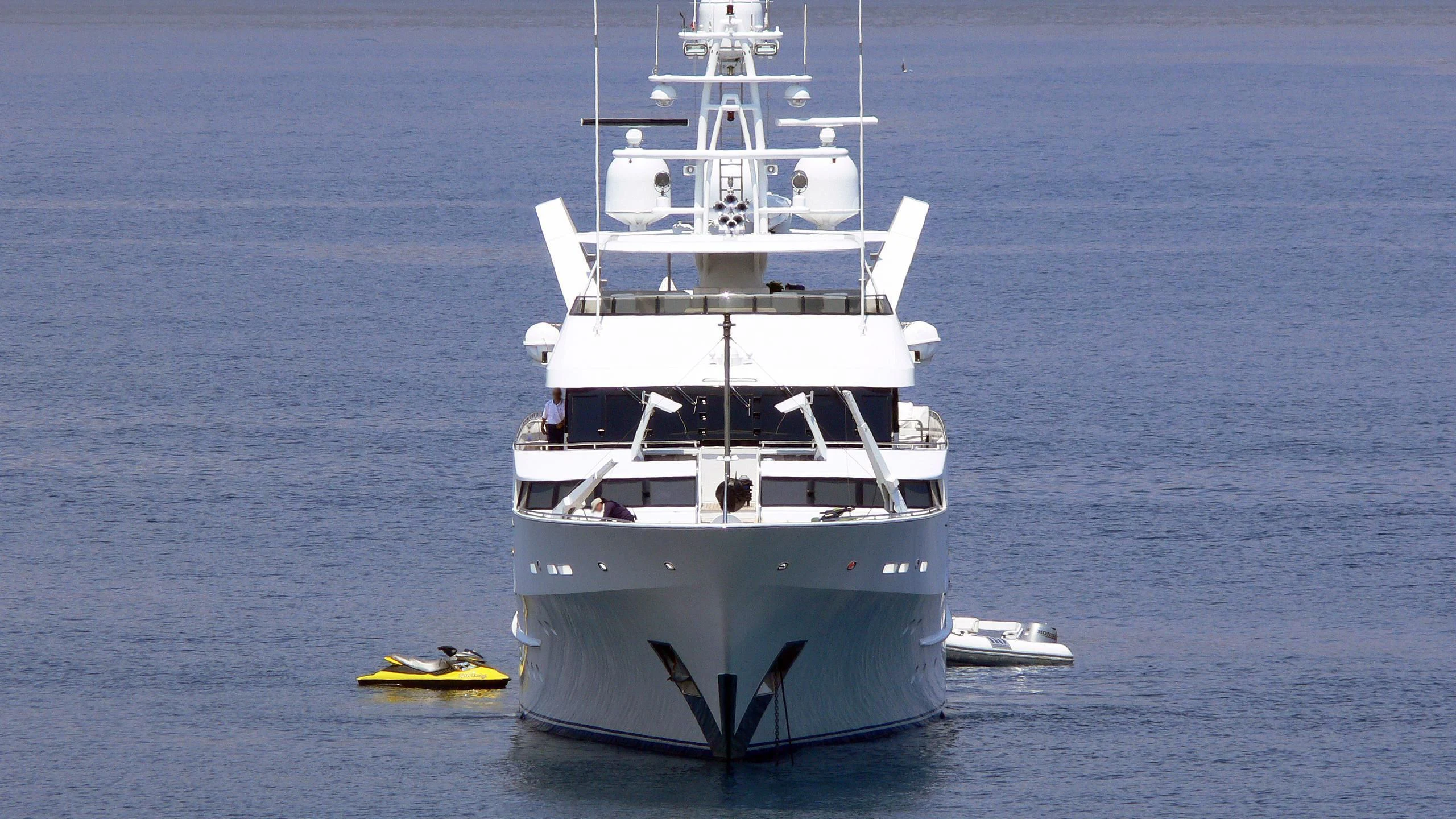 a large white boat in the water aboard NEVER ENOUGH Yacht for Charter