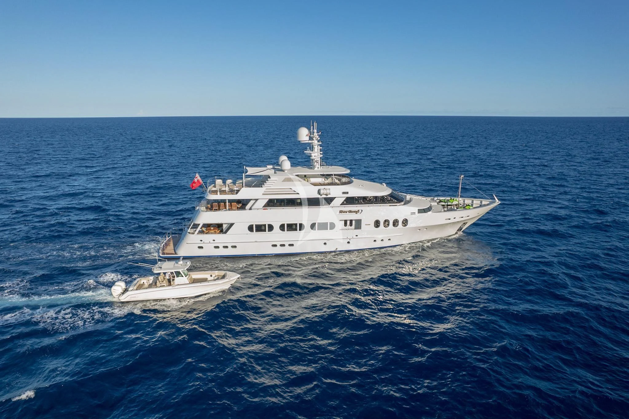 a large white ship in the water aboard NEVER ENOUGH Yacht for Charter
