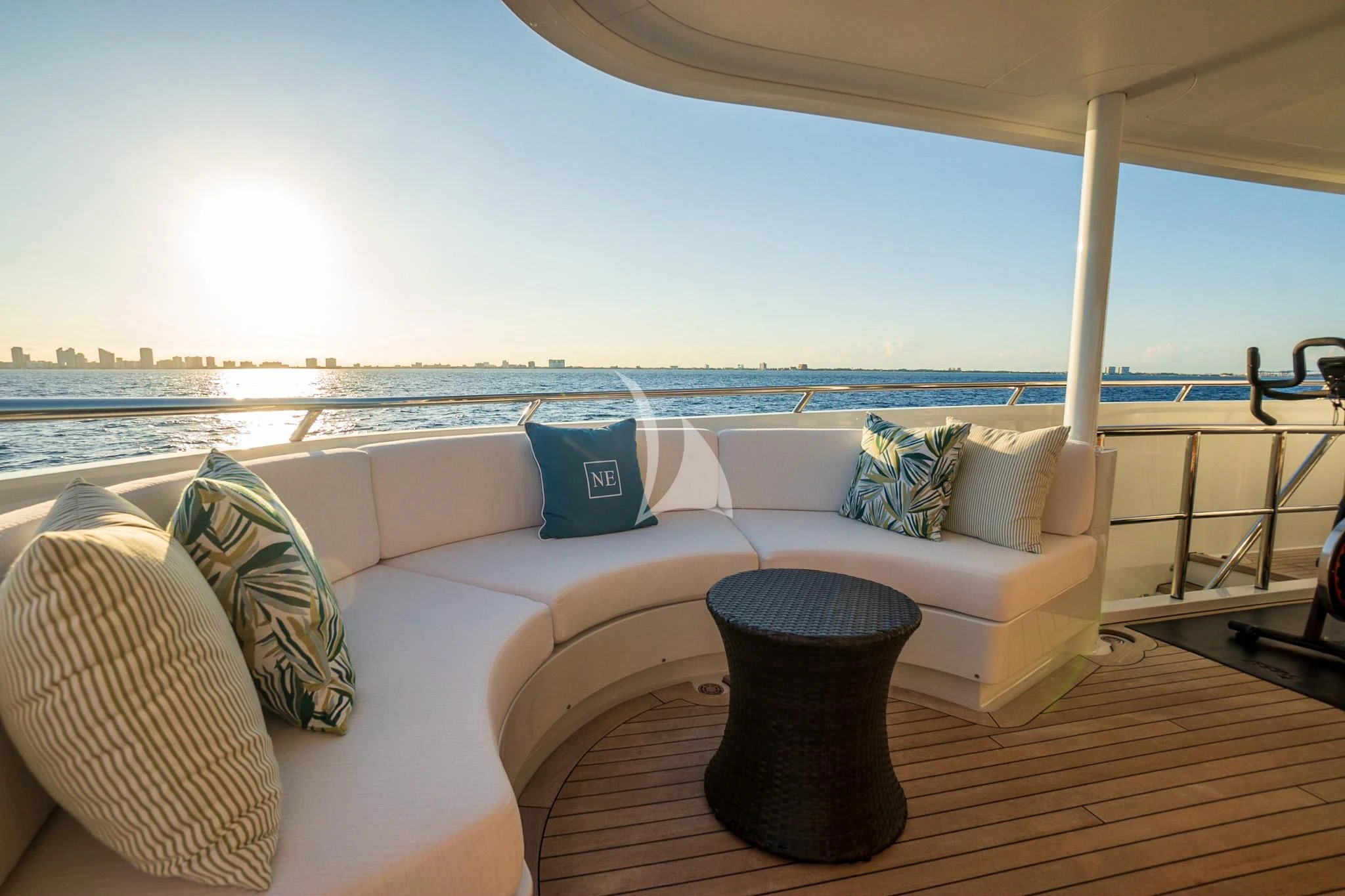 a couch with pillows on it aboard NEVER ENOUGH Yacht for Charter