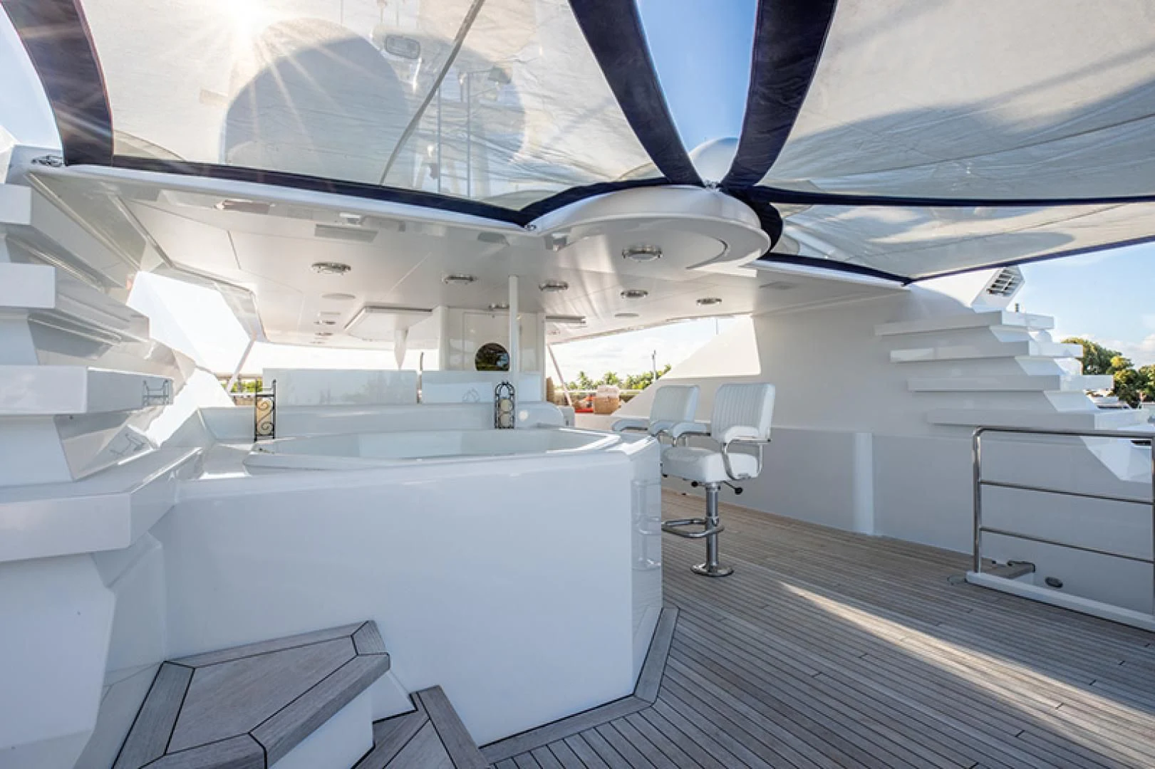 a room with white walls and a wood floor aboard NEVER ENOUGH Yacht for Charter