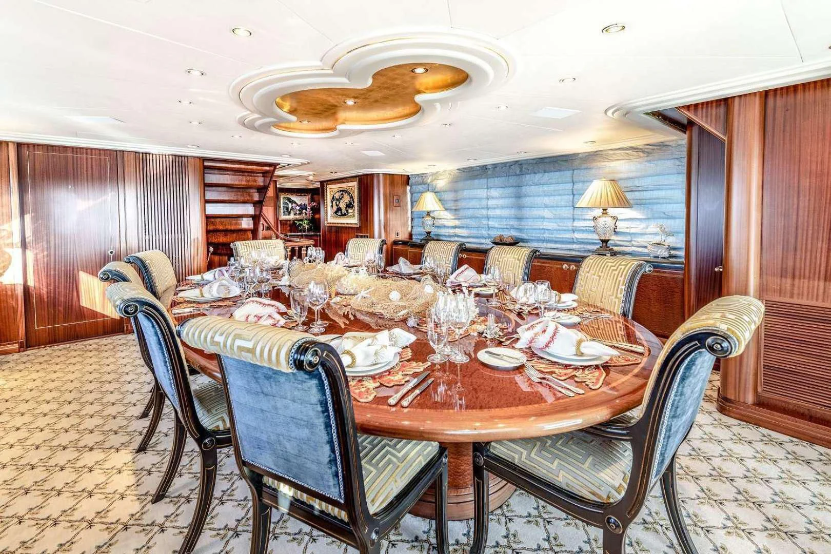 a dining room with a table and chairs aboard NEVER ENOUGH Yacht for Charter