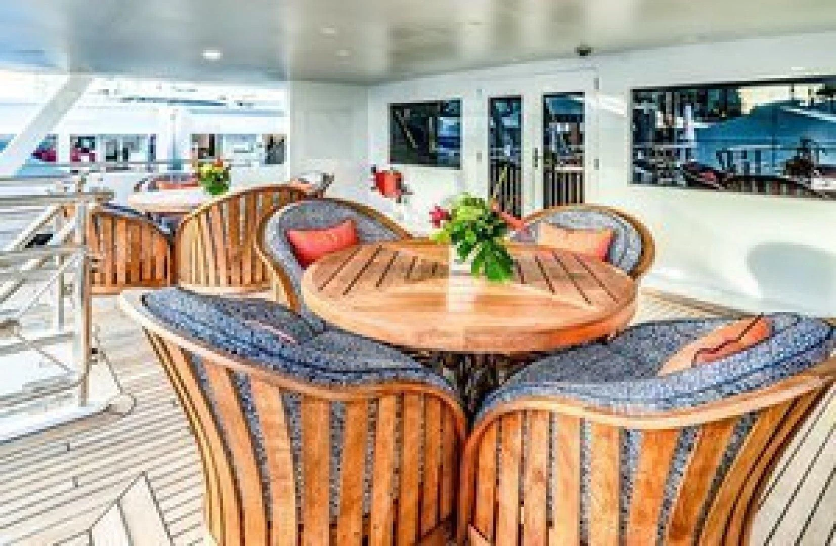 a dining room with a table and chairs aboard NEVER ENOUGH Yacht for Charter