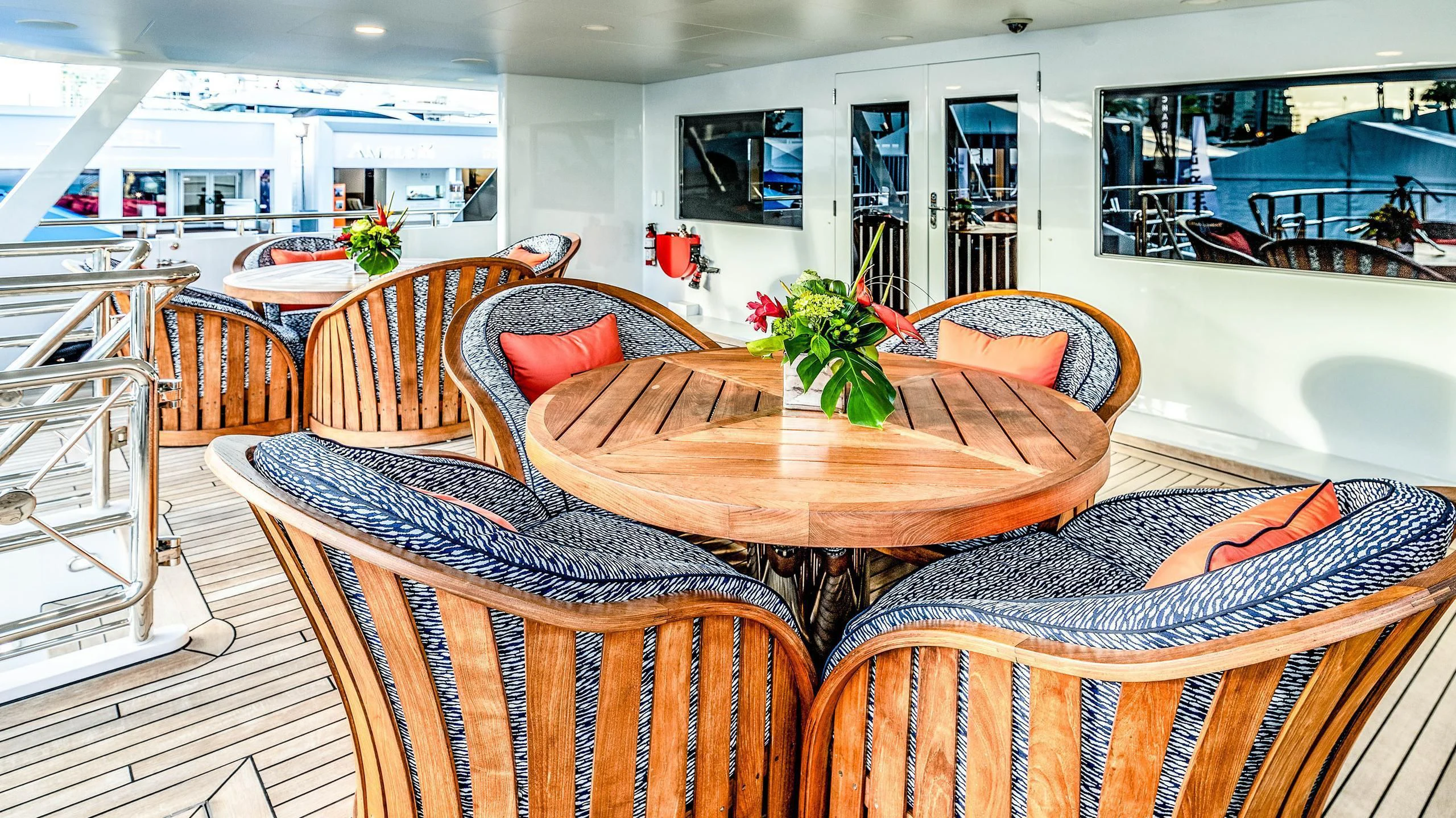 a living room with a table and chairs aboard NEVER ENOUGH Yacht for Charter