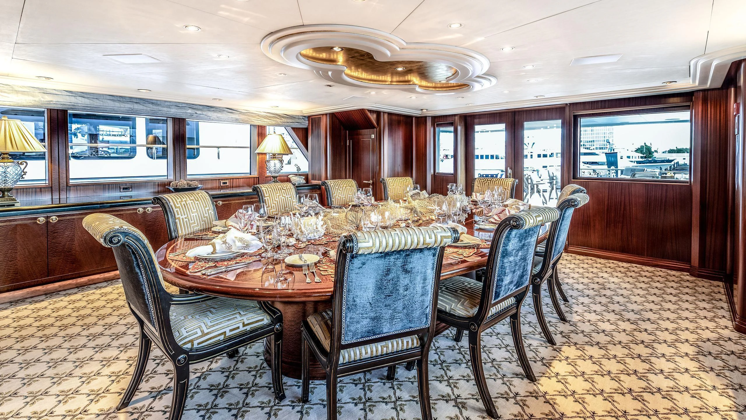 a dining room with a table and chairs aboard NEVER ENOUGH Yacht for Charter