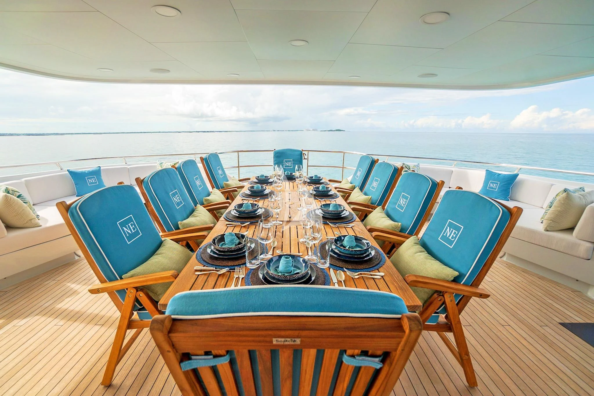 a room with a table and chairs aboard NEVER ENOUGH Yacht for Charter