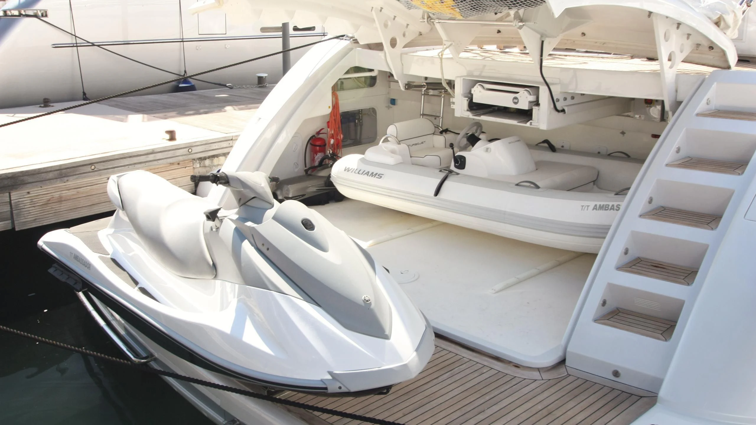 a white boat with a white sail aboard JADE Yacht for Sale