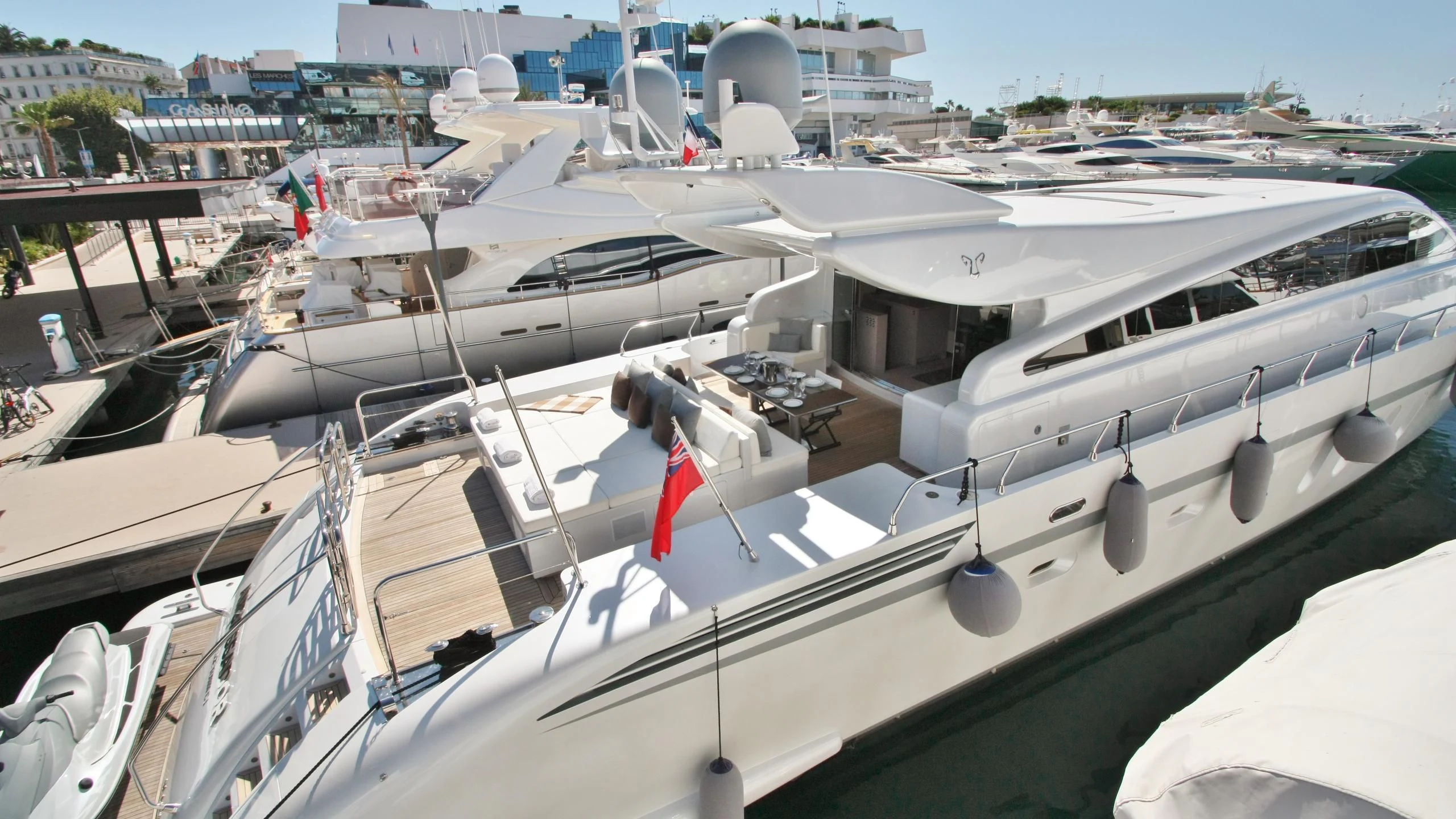a boat docked at a pier aboard JADE Yacht for Sale