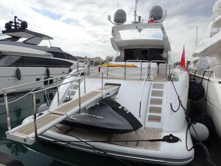 a boat docked at a pier aboard JADE Yacht for Sale