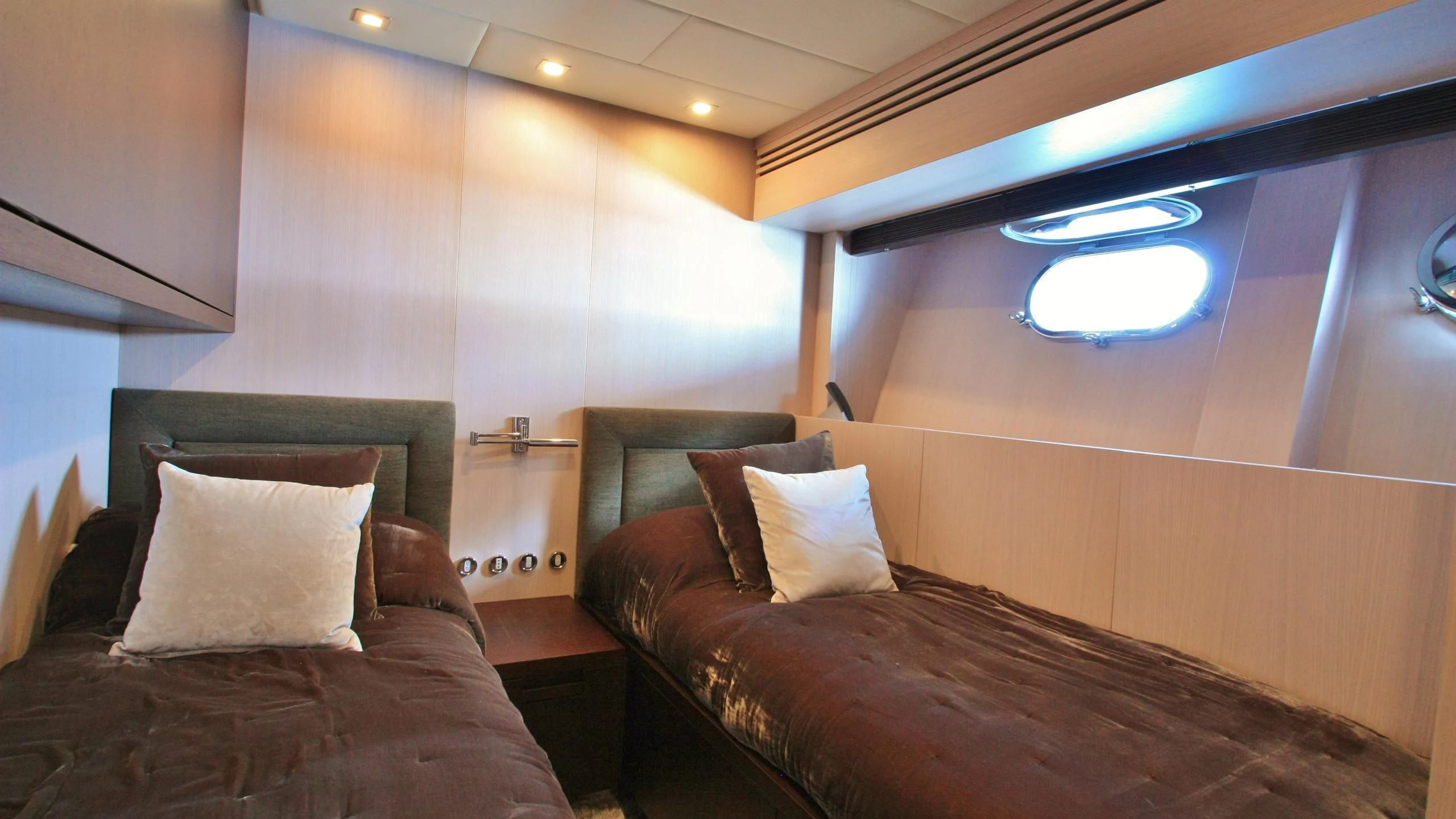 a room with a bed and a table aboard JADE Yacht for Sale