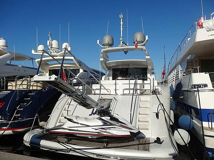 a boat docked at a pier aboard JADE Yacht for Sale