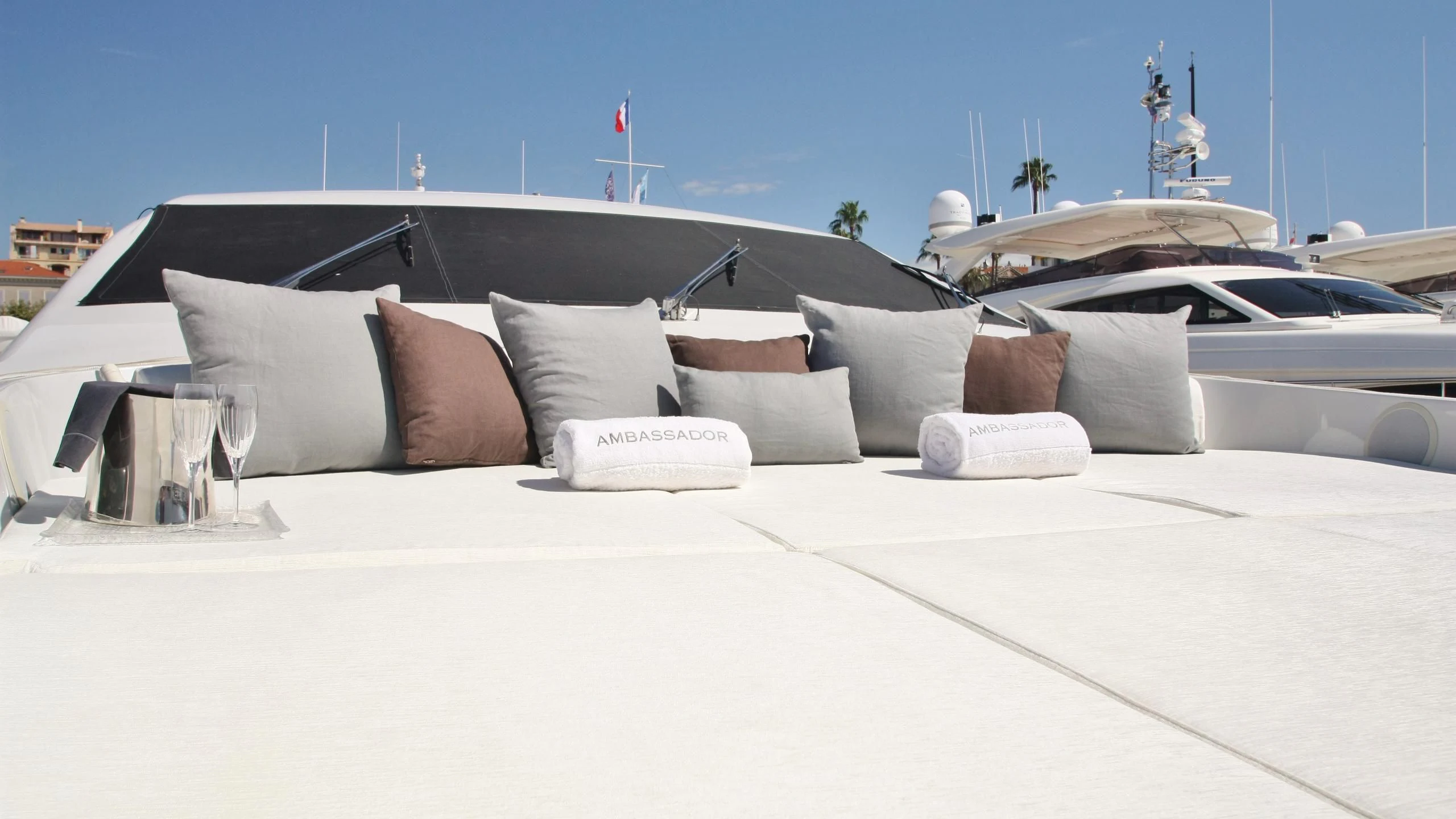 a white bed with pillows aboard JADE Yacht for Sale