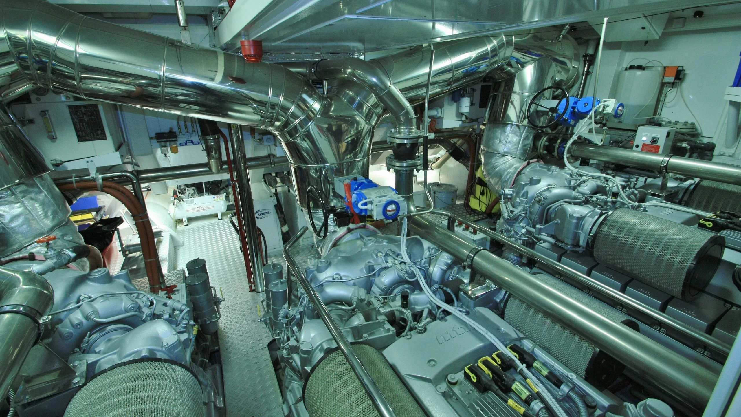 a person in a room with many machines aboard JADE Yacht for Sale