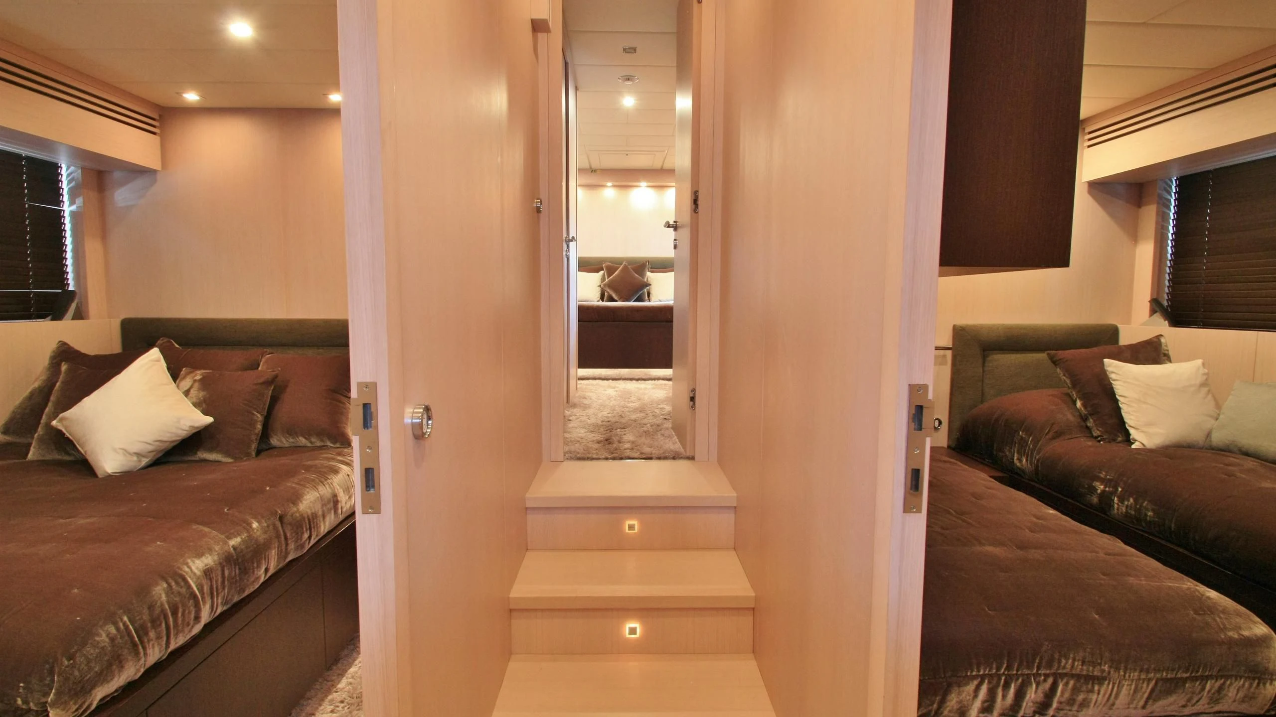 a room with a bed and a couch aboard JADE Yacht for Sale
