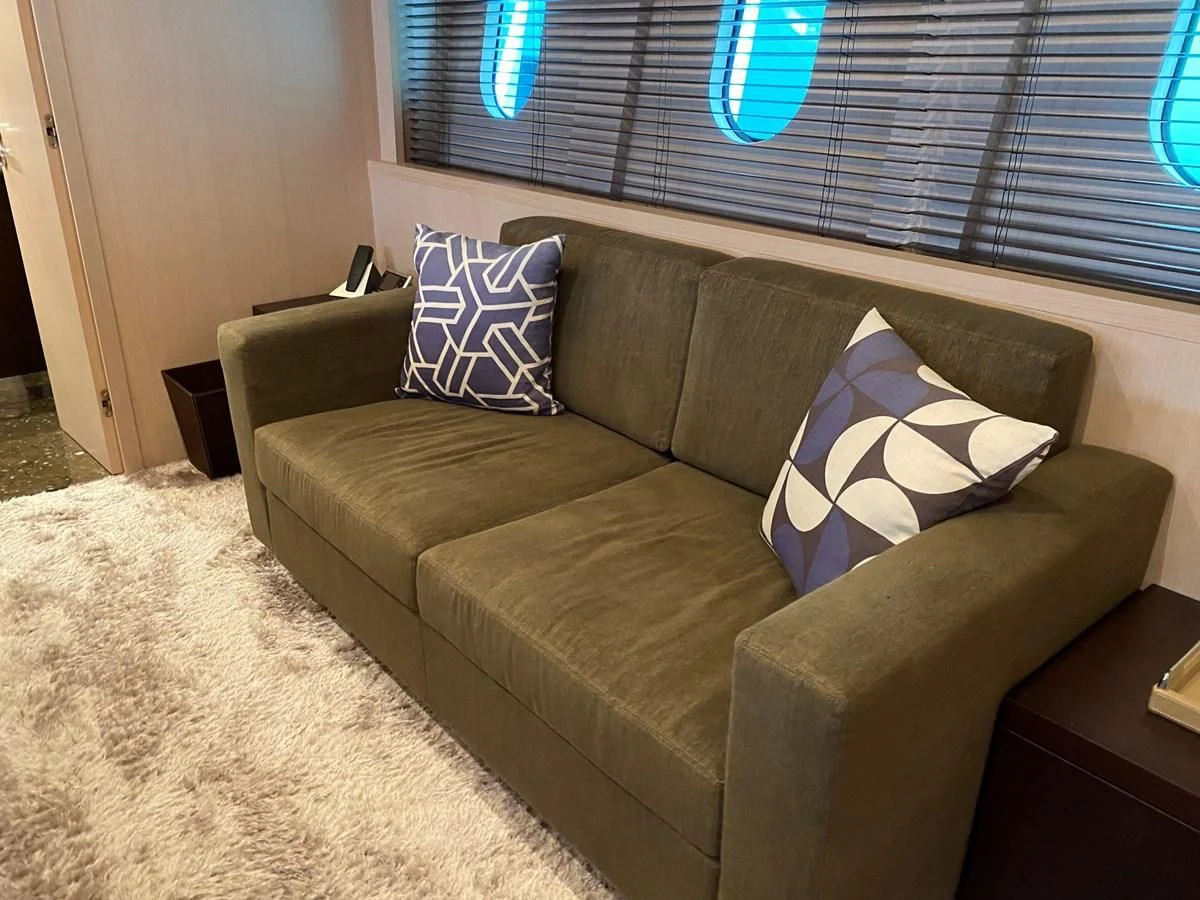 a couch in a room aboard JADE Yacht for Sale
