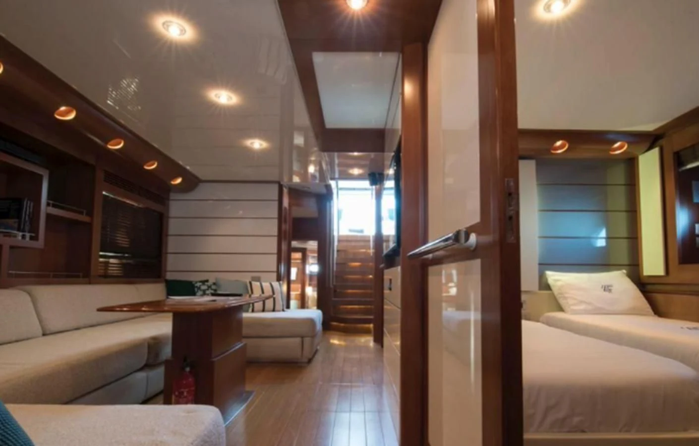 a room with a bed and a table aboard 4F Yacht for Sale