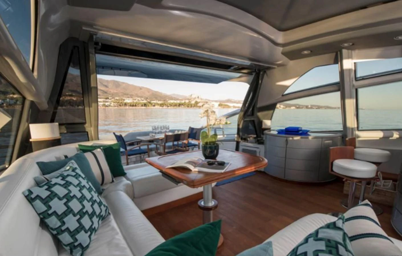 a room with a table and chairs aboard 4F Yacht for Sale