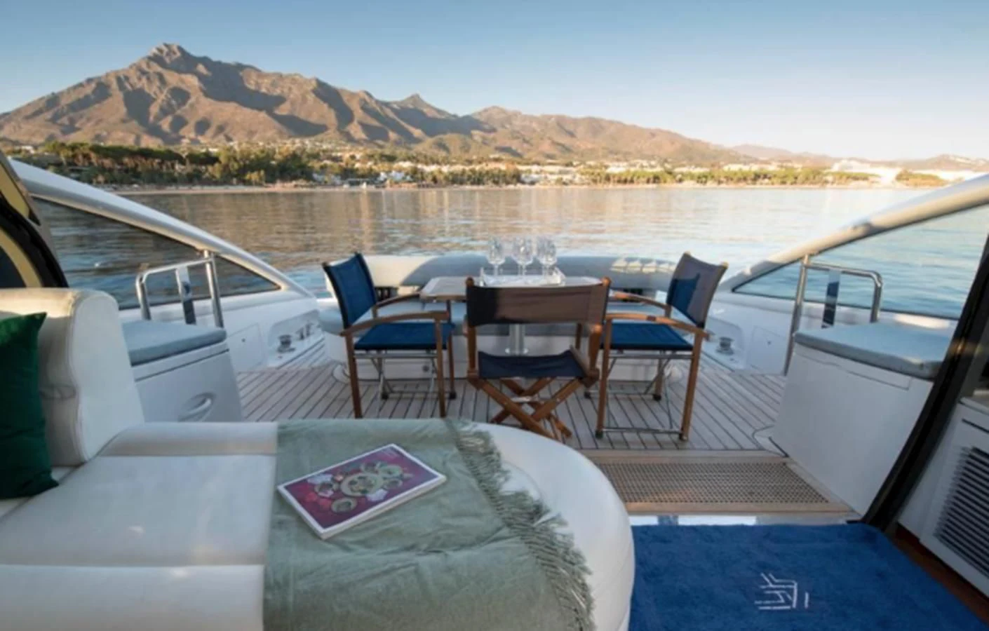 a boat with a table and chairs on it aboard 4F Yacht for Sale