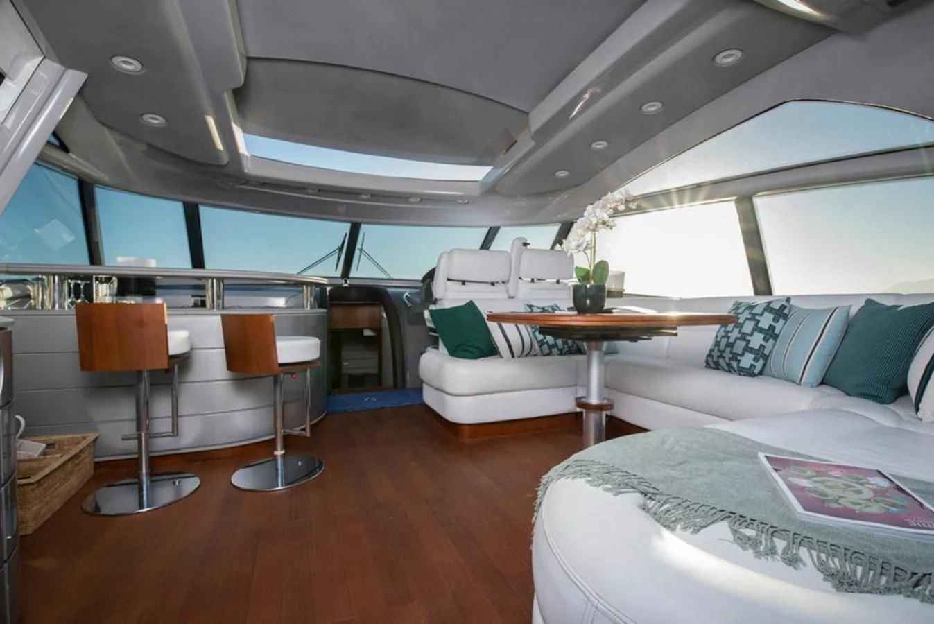 a room with a couch and a table and a chair aboard 4F Yacht for Sale