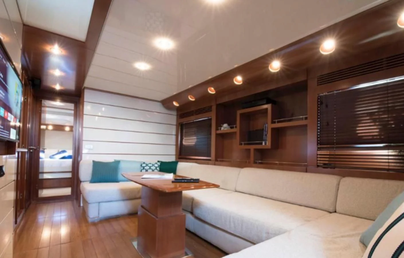 a living room with a wood floor aboard 4F Yacht for Sale