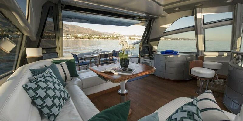 a room with a table and chairs aboard 4F Yacht for Sale